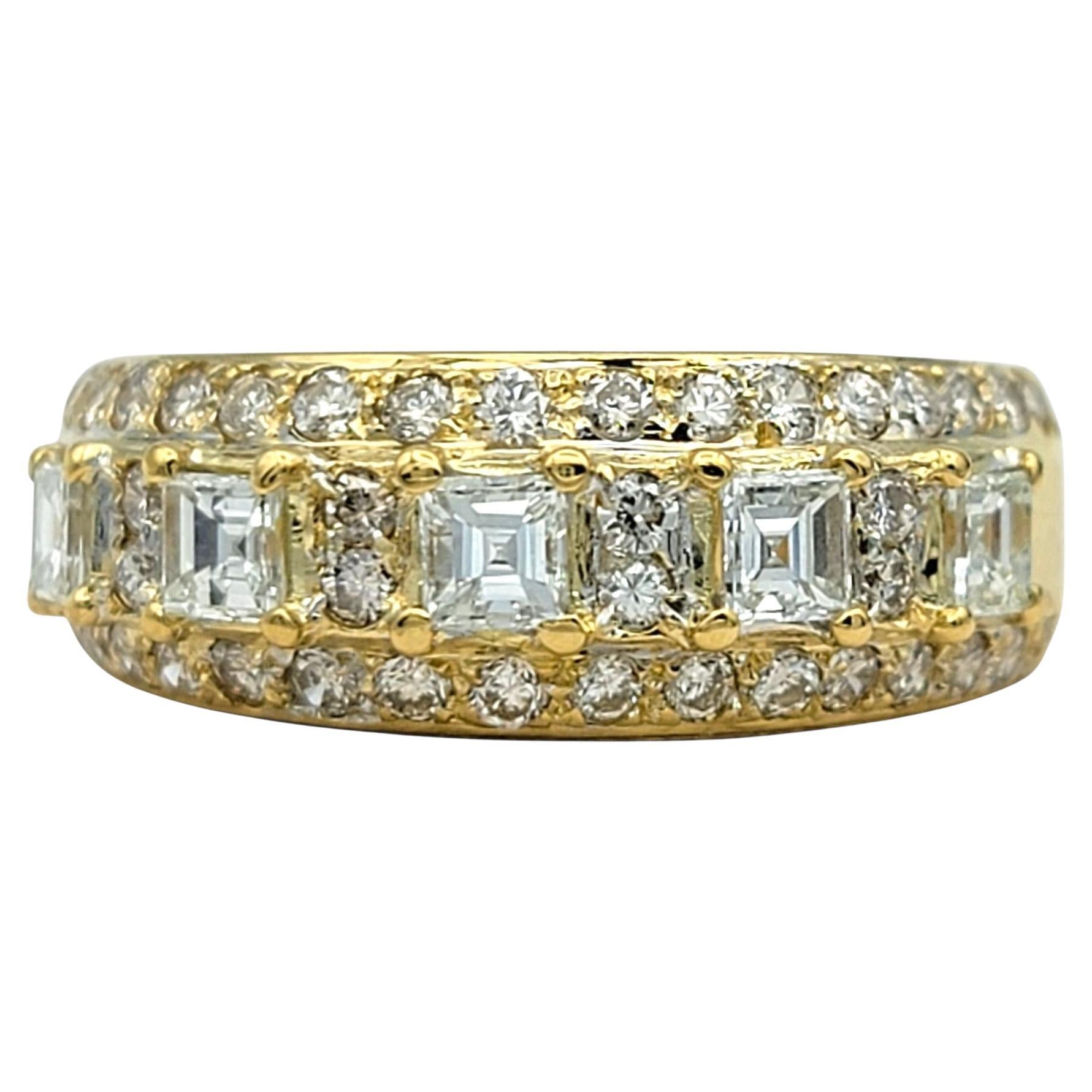 Ring Size: 7.5

This elegant diamond ring features a bold row of square emerald cut diamonds, framed on either side by sparkling round brilliant cut stones. The central diamonds give a crisp, geometric appeal, while the rounds add classic
