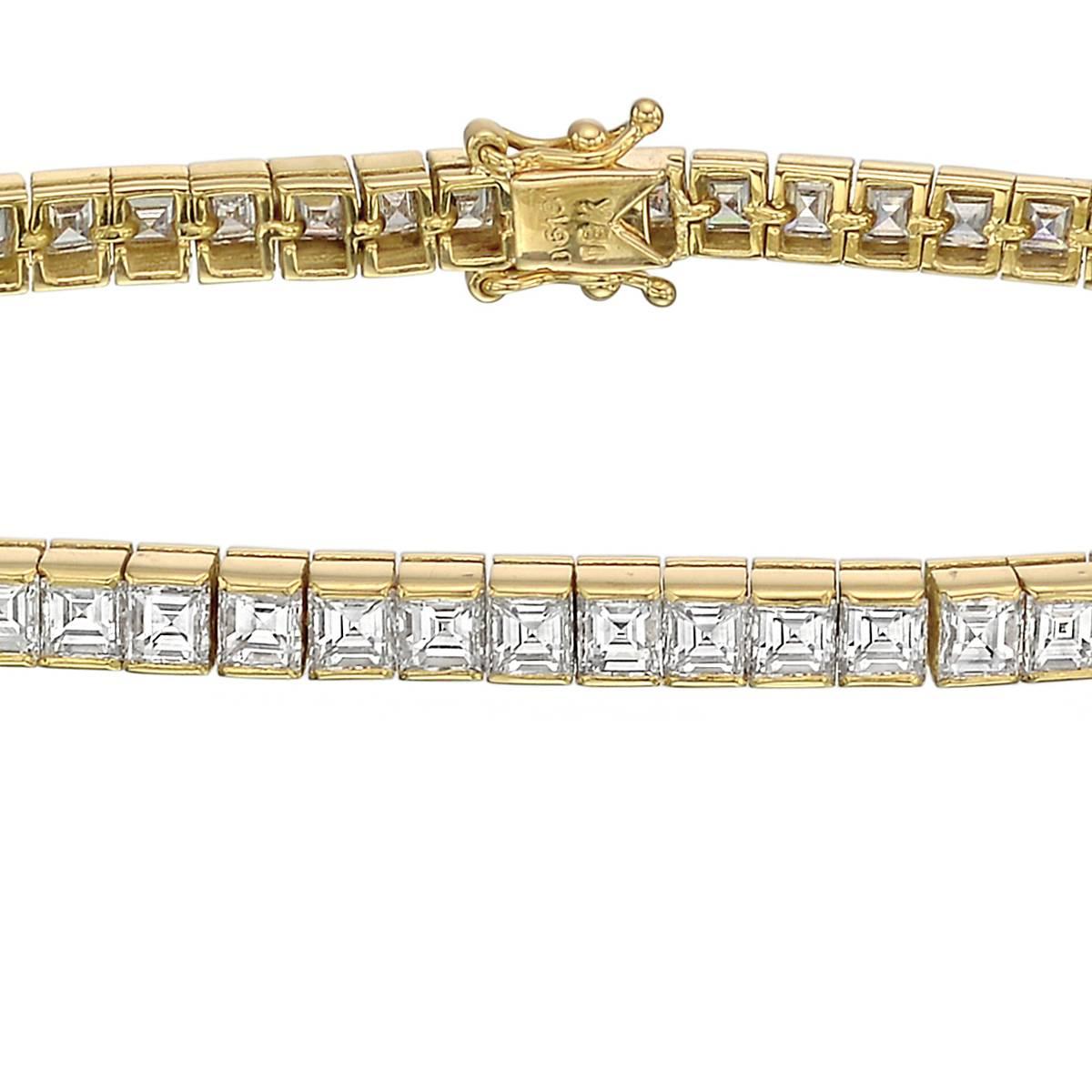 Square emerald-cut diamond line bracelet, the diamonds channel-set in 18k yellow gold. Near-colorless diamonds weighing approximately 6.13 total carats (averaging H-I color/VS1-VS2 clarity, or better). 6.75