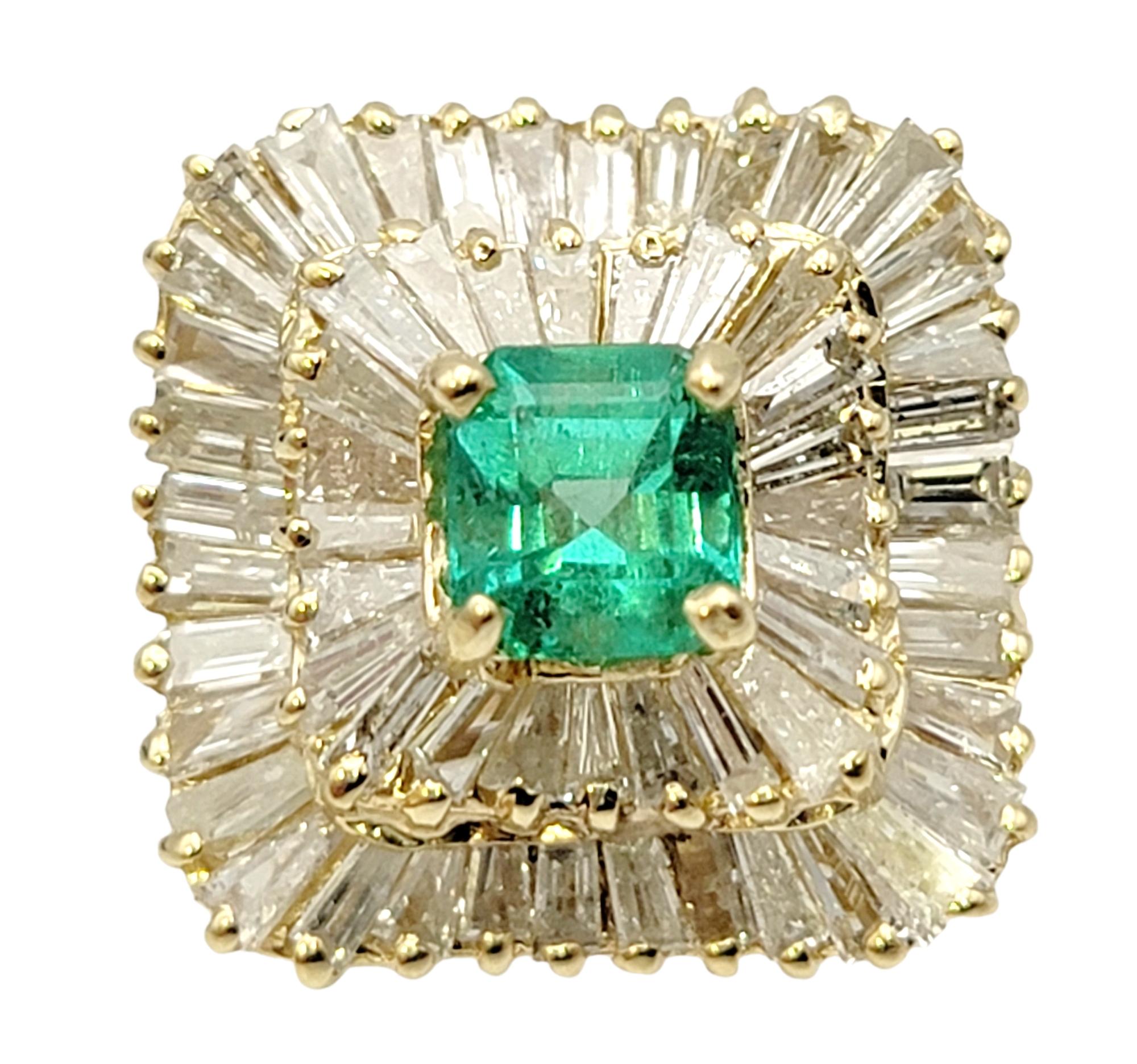 Ring size: 6

This stunning emerald and diamond cocktail ring is the absolute epitome of elegance. It features a single square emerald cut natural emerald in a stunning bright green color, four prong set at the center of the piece. A double halo of