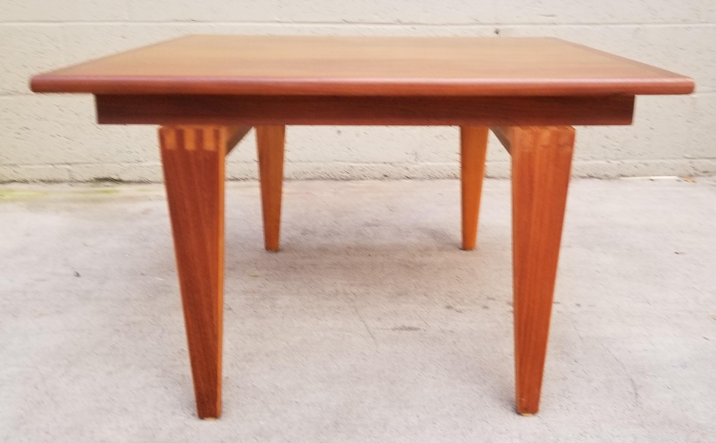 A Mid-Century Modern square end table or coffee table with bold, finger-joint construction. Quality materials and workmanship. Notice exceptional wood grain to top surface. Very good vintage condition with original finish. Very sturdy.