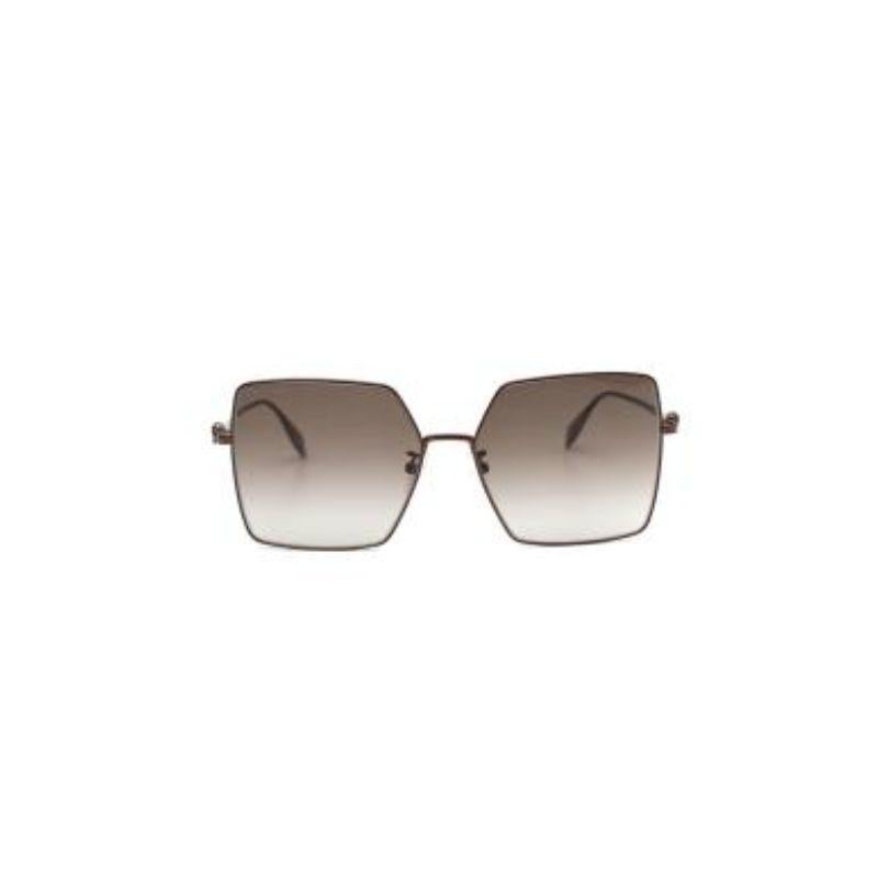 Alexander McQueen square frame gradient lens AM0273S Skull Sunglasses
 
 - Brown gradient lens in an oversize, square cut with a narrow metal rim
 - Narrow metal arms adorned with a signature skull at the temple 
 - 'Alexander McQueen' logo embossed