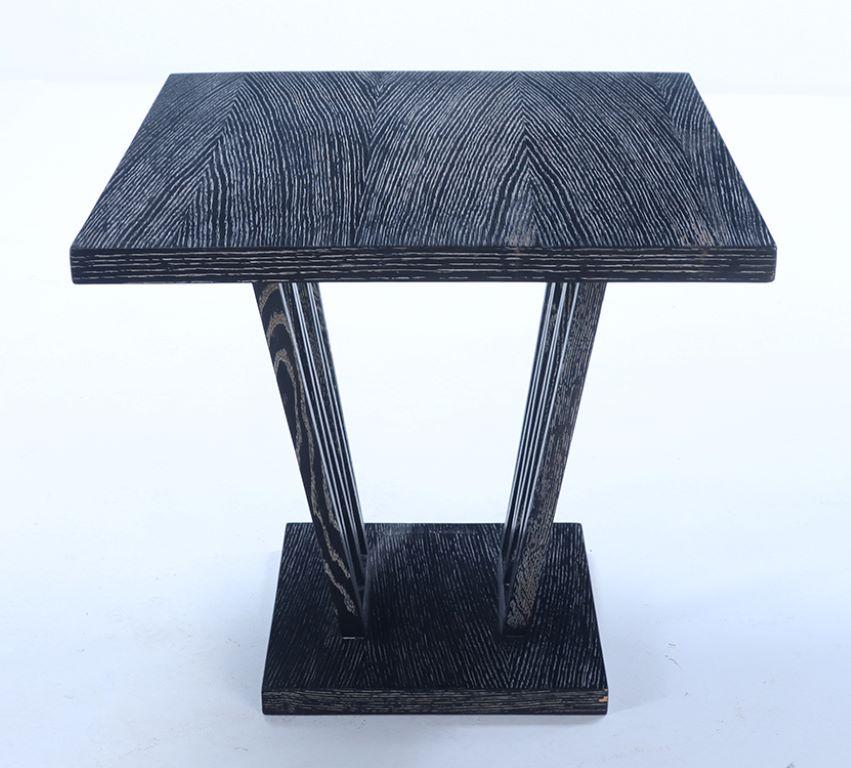 A square French, dark, cerused oak occasional table with interesting base circa 1945.