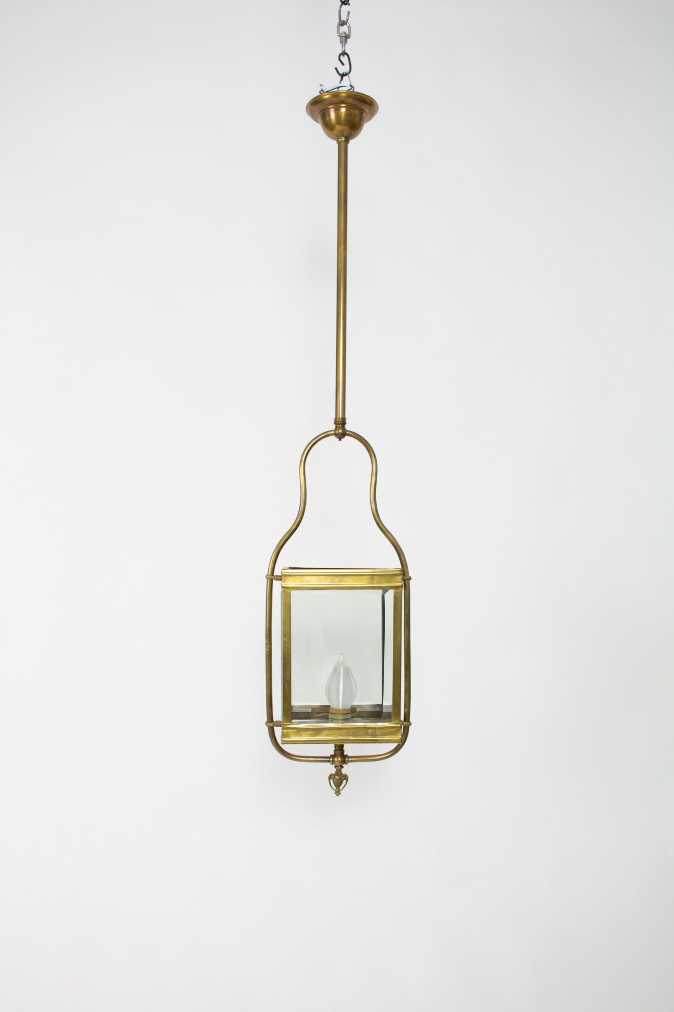 Originally gas, this lantern has it’s original beveled glass panels. Made of brass. The overall length is currently 41?. C. 1890

Dimensions: 
Height: 41
Width (Diameter): 9.