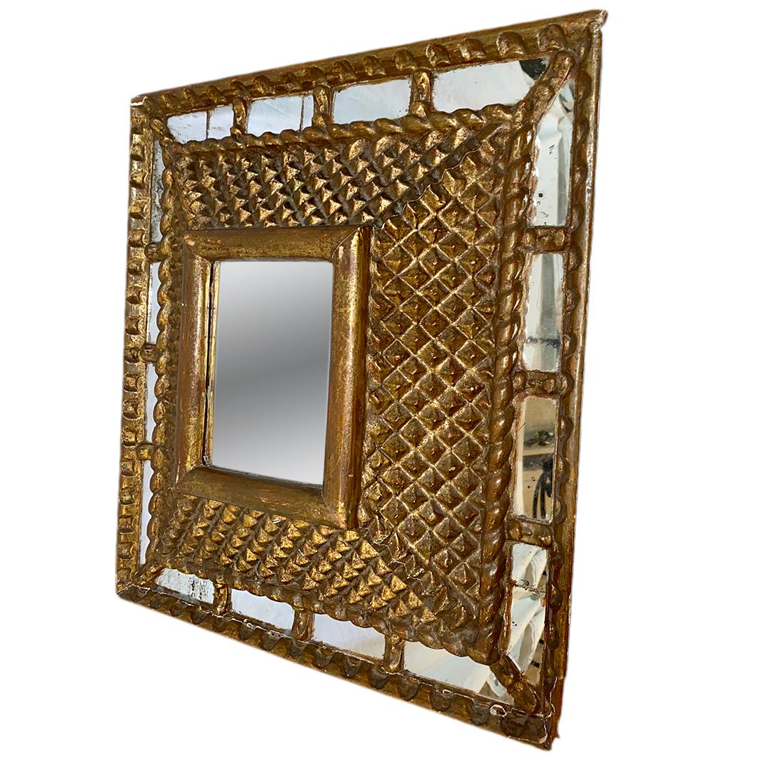 A circa 1920's square Spanish gilt wood mirror.

Measurements:
Diameter: 21