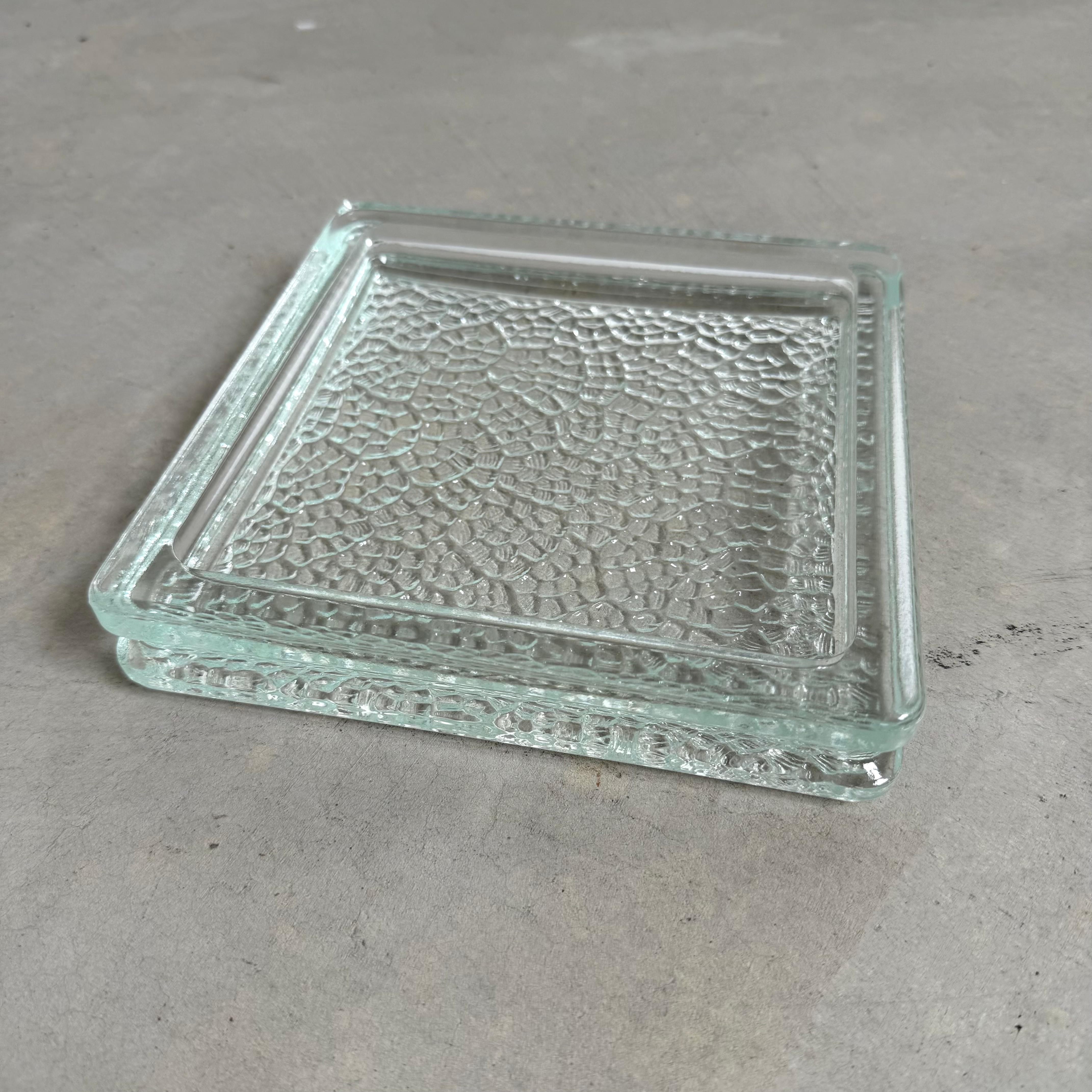 Beautiful square glass ashtray/catchall made by NEVADA. Made in France back in the 1950s. Often used in Jacques Adnet furniture. We have the ashtrays for sale individually. 7 available.

Located in our Los Angeles showroom. 