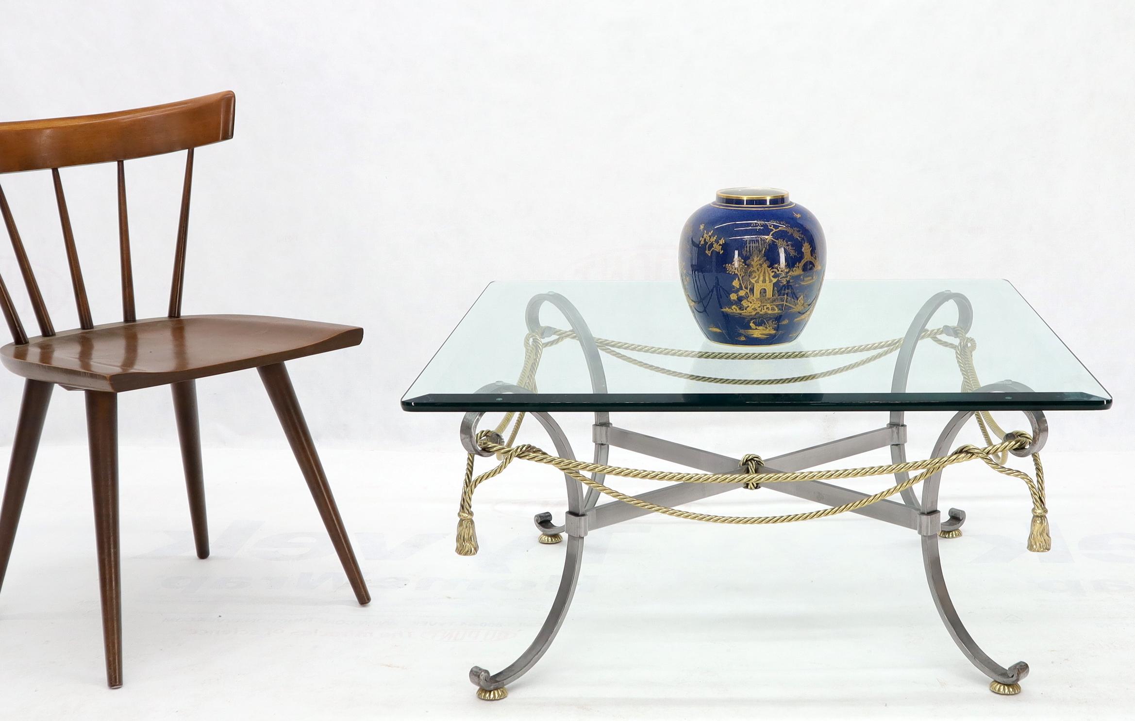 Mid-Century Modern beveled glass top mix metals base coffee table in style of Mason Jansen.