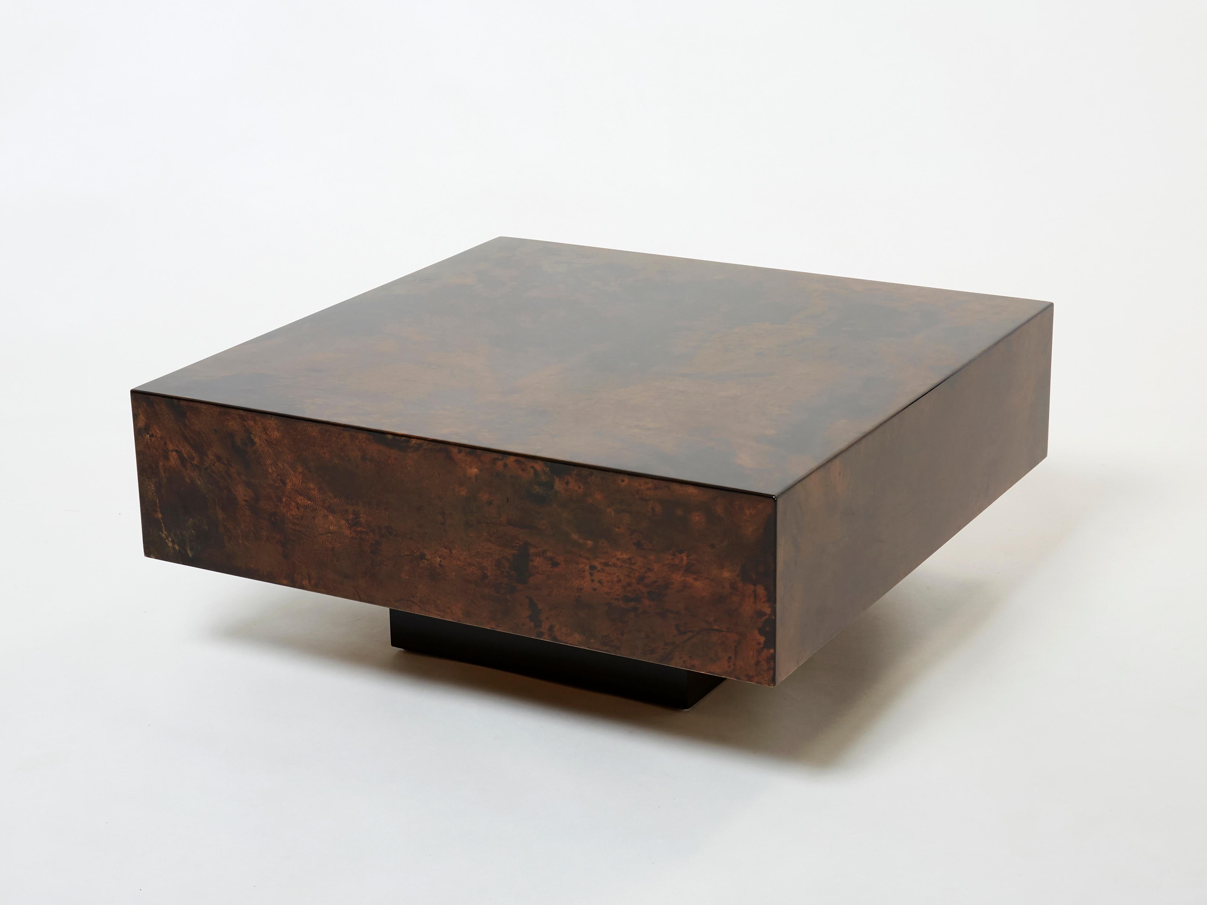 The varnished goatskin parchment, in rich shades of brown, makes this square coffee table typical of designer Aldo Tura. This small coffee table or end table would make a perfect warm and chic piece for any living room. It’s been beautifully