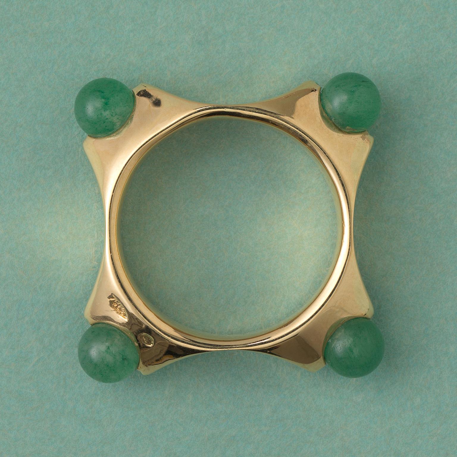 A cool 18 carat gold square shaped ring each corner set with a aventurine ball, France.

size: 8.75 mm. 8 ¾ US.
weight: 6.85 grams.
width: circa 7 mm.
size aventurine balls: 5 mm.