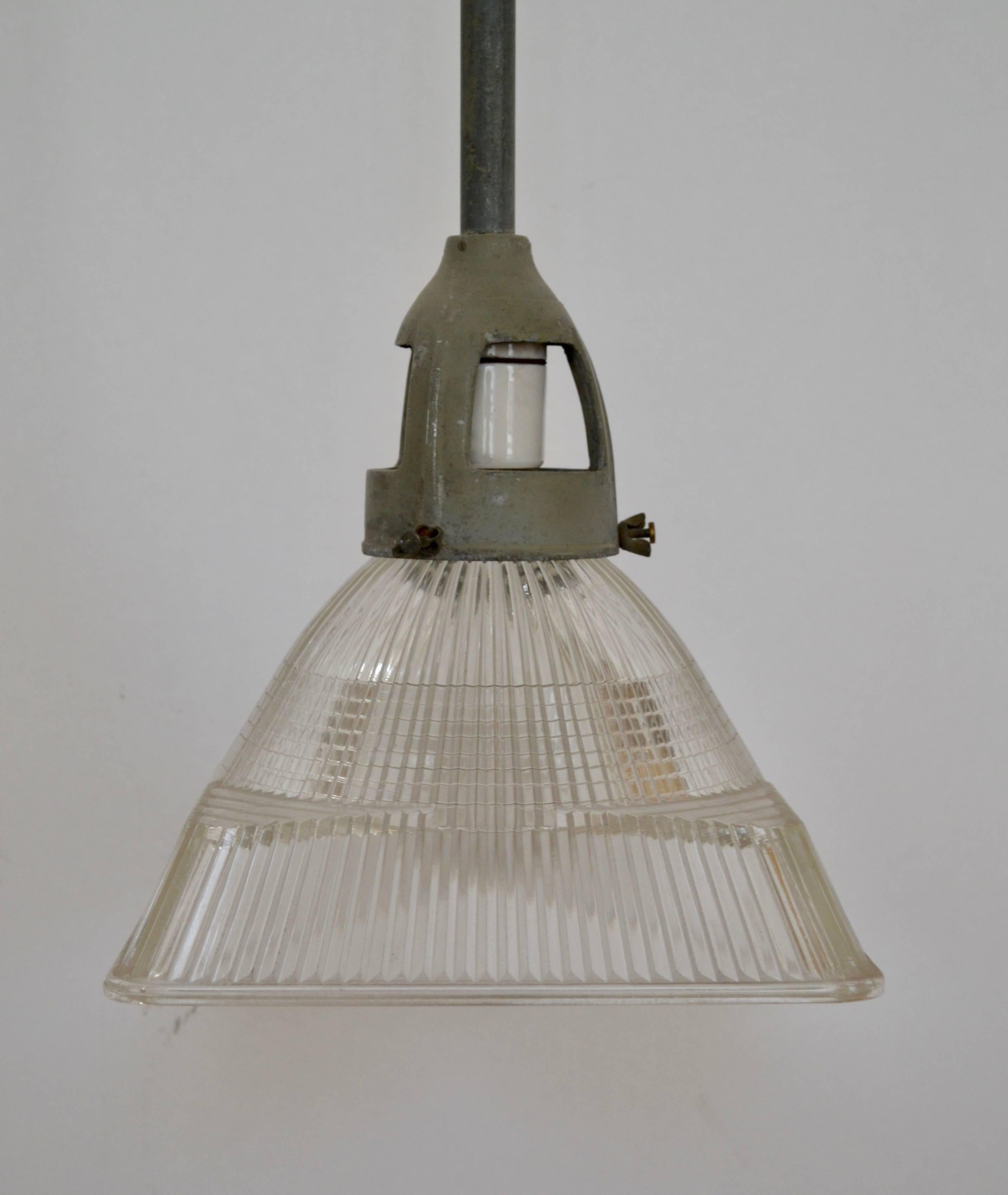 Rare square prismatic Holophane shade complete with original hanging hardware including cast aluminium ventilated collar, RMC stem and ball-swivel canopy. Shade secured to collar via three winged thumb screws and illuminated by single porcelain