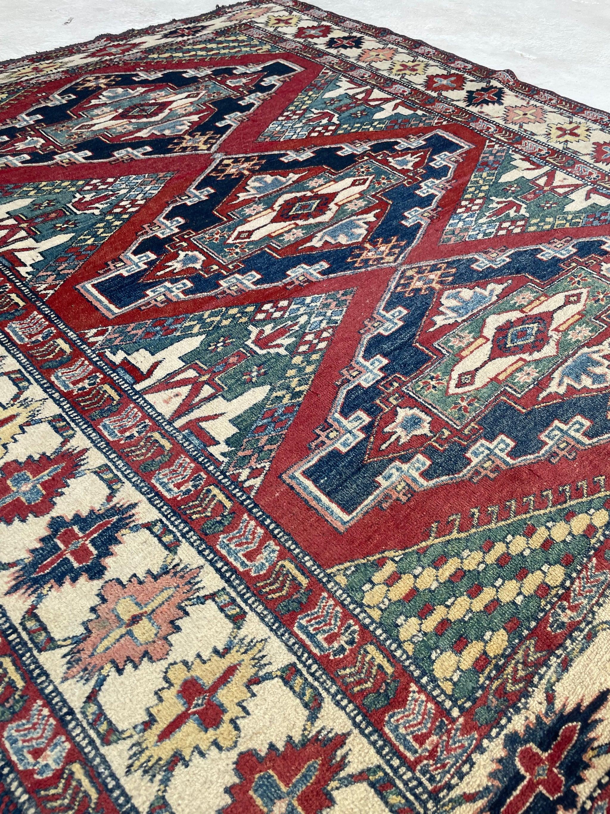 Unique Square-ish Vintage Tribal Rug  Iconic Kazak Medallions with Lovely Greens & Yellows  

About: Lovely piece in Rare size!  Tough strong wool, bullet-proof rug with iconic geometric medallions and rare colors such as greens and yellows with