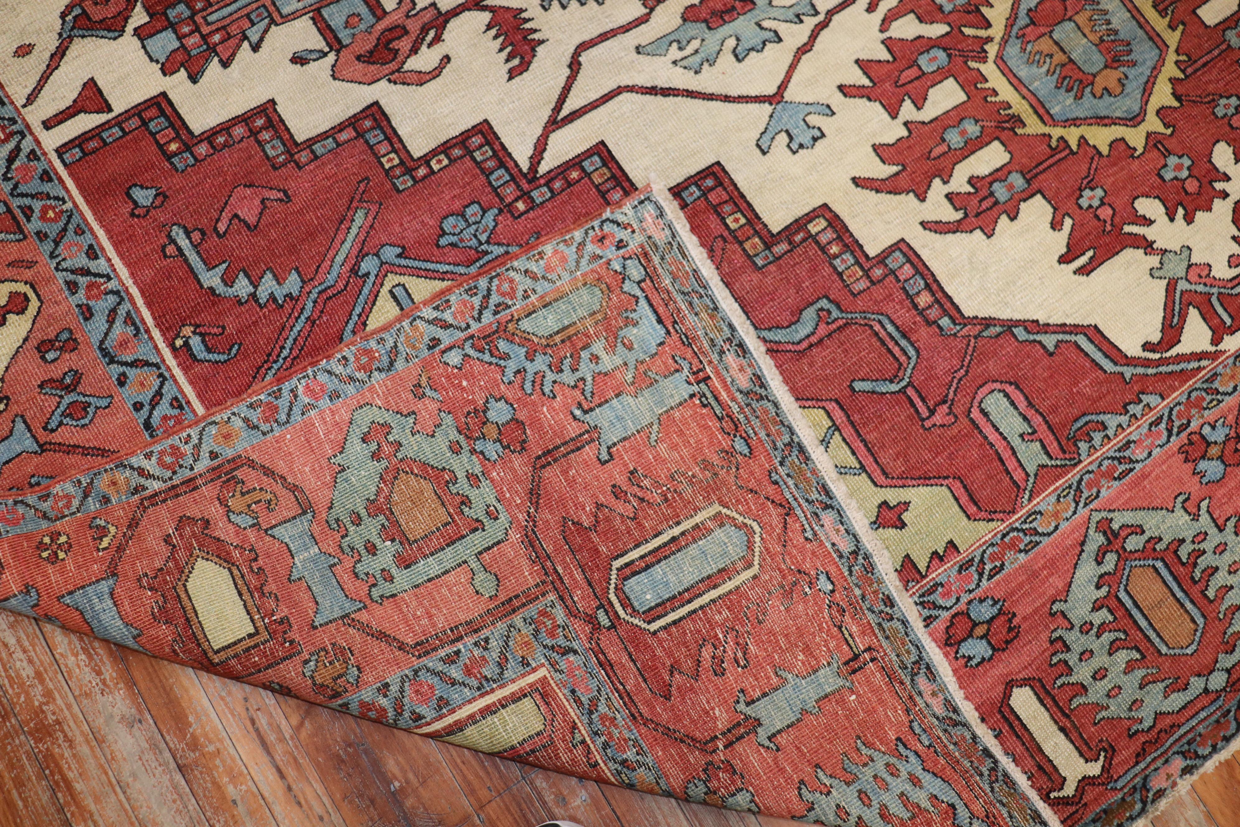 Stellar late 19th century antique Serapi carpet. Ivory ground, teal-blue medallion and rusty pink border.

19th century, Serapi carpets feature a fascinating spacious designs that are often asymmetrical while maintaining an astonishing balance and