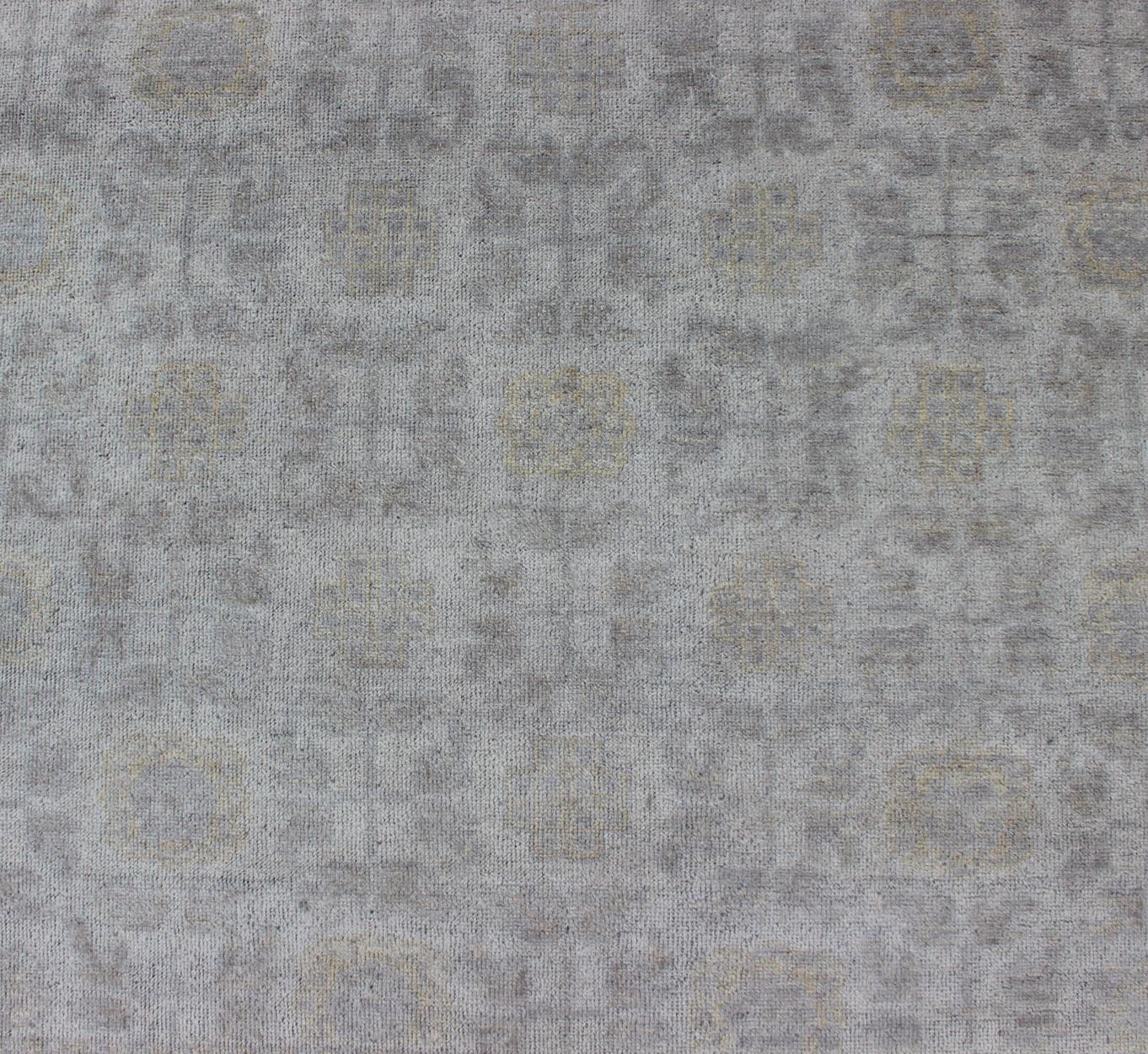 Square size Khotan Rug in Ivory, Soft Yellow, Light Gray/Light Purple and Neutral tones by  Keivan Woven Arts. 21st Century Square Khotan Rug

Measures: 6'7 x 6'7 

Square Size Hand Knotted Khotan Rug, Keivan Woven Arts rug/OB-9365708, 21st Century