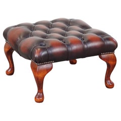 Square leather chesterfield ottoman with elegant wooden legs