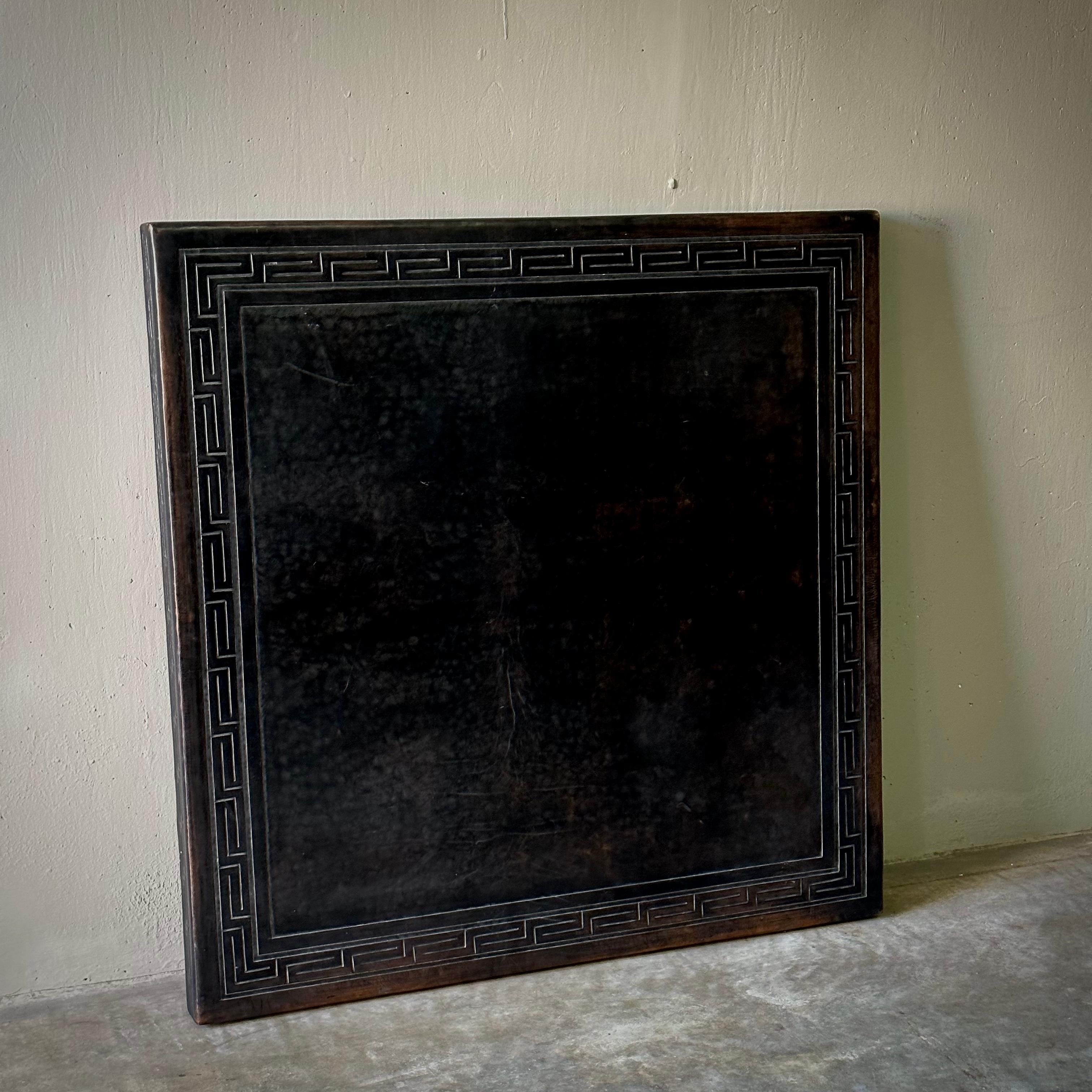 Dutch mid-century square black leather table top, in the style of the legendary designer Angel Pazmino. Features elegant embossed Greek key motif at perimeter and exquisite patina. A handsome piece with understated mid-century flair and great