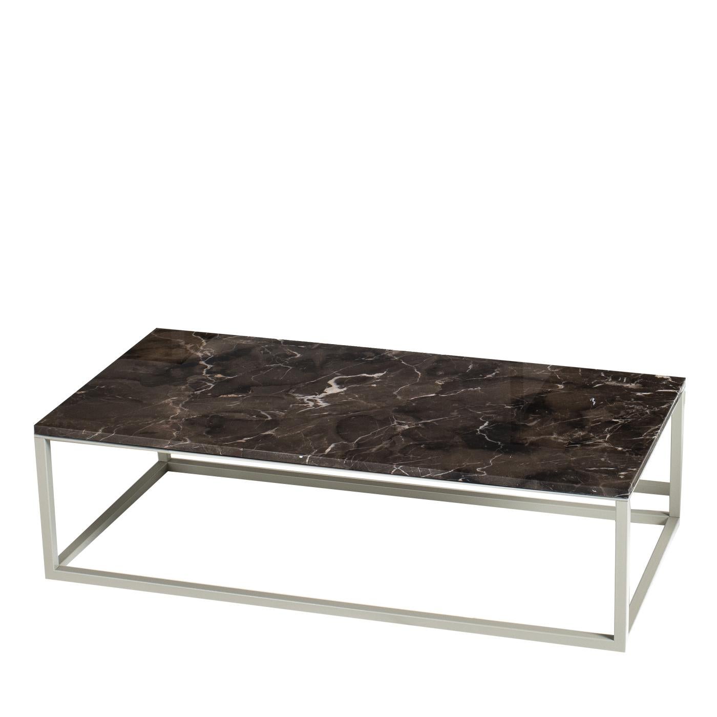 Characterized by a slim, minimalist design, the square less coffee table is an effortlessly chic piece for contemporary living rooms. Making the table extra light is the designer's decision to place the top directly on the base. Best of all, the