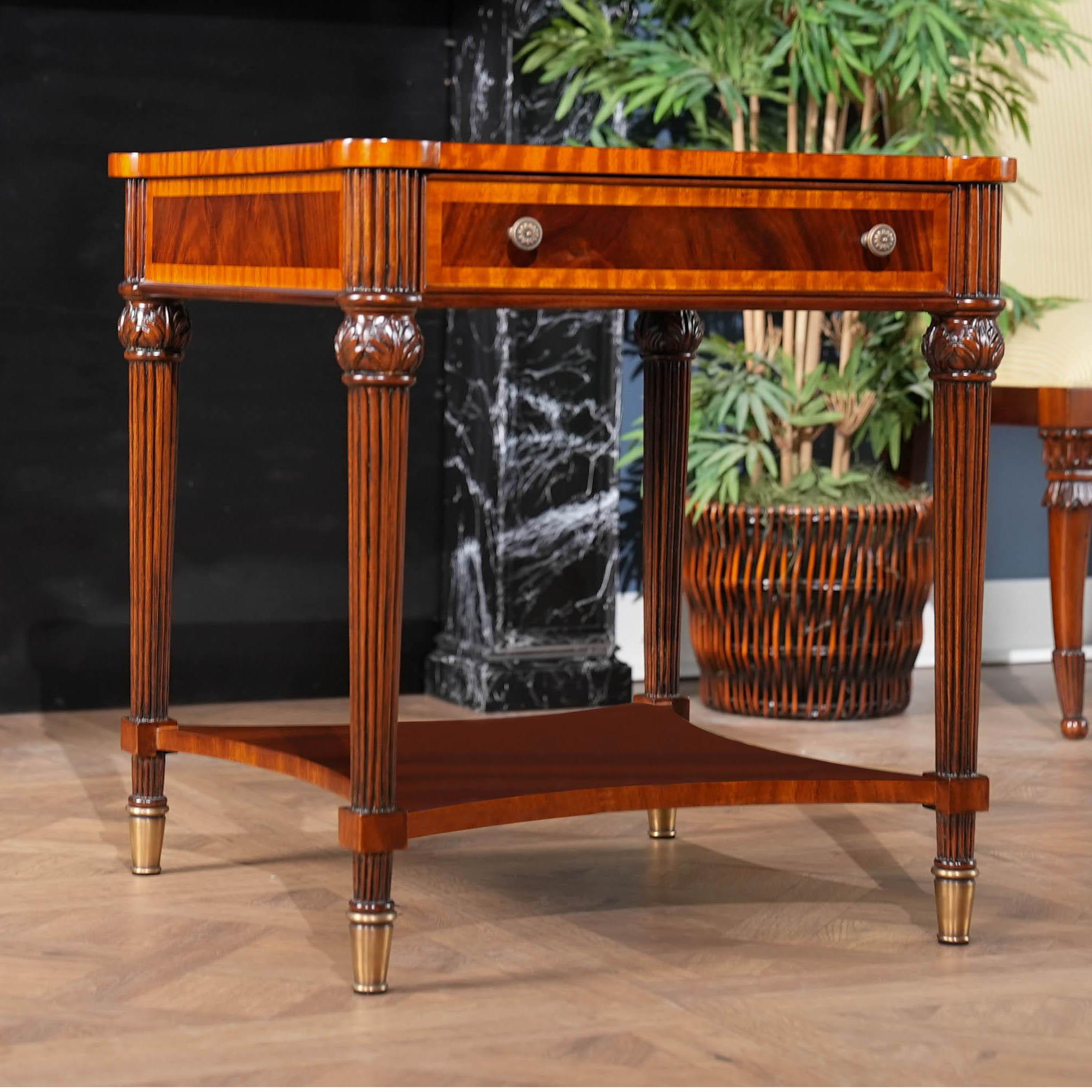 A Square Mahogany End Table from Niagara Furniture with all of the bells and whistles including one drawer, reeded legs, solid brass capped feet and cookie shaped, rounded corners. Great quality construction and attention to detail make this a