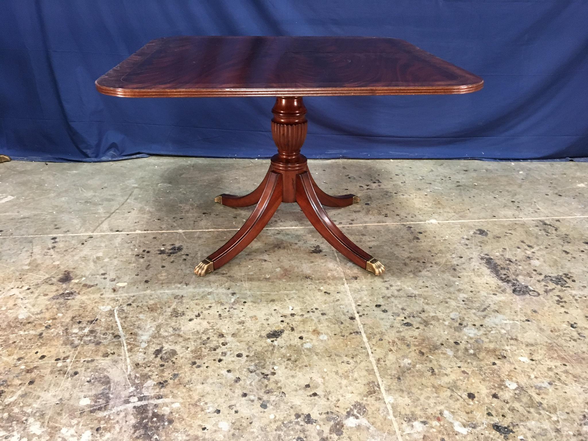 This is a made-to-order square traditional mahogany accent/foyer table made in the Leighton Hall shop. It features a field of reverse-slip-matched crotch mahogany with a contrasting border separated by ebony and white maple inlay lines. It has a
