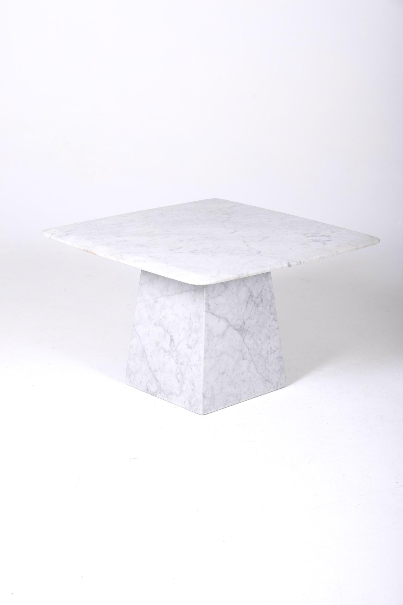 Square coffee table or side table with a tabletop supported by a white and gray marble pedestal.
DV161
