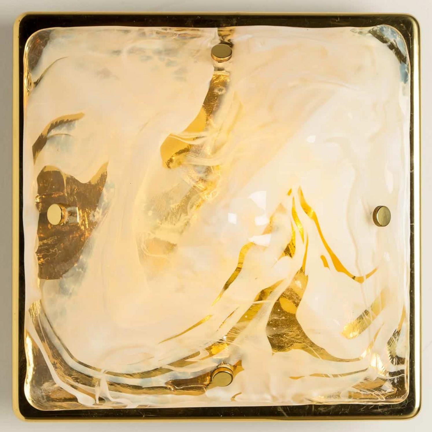 Beautiful high quality light fixture made by Hillebrand, Germany 1960.

This flush light/wall light features lights made of handmade marbled glass and brass colored back plate. The sides refract light beautifully and are perfect for a soft, warm and