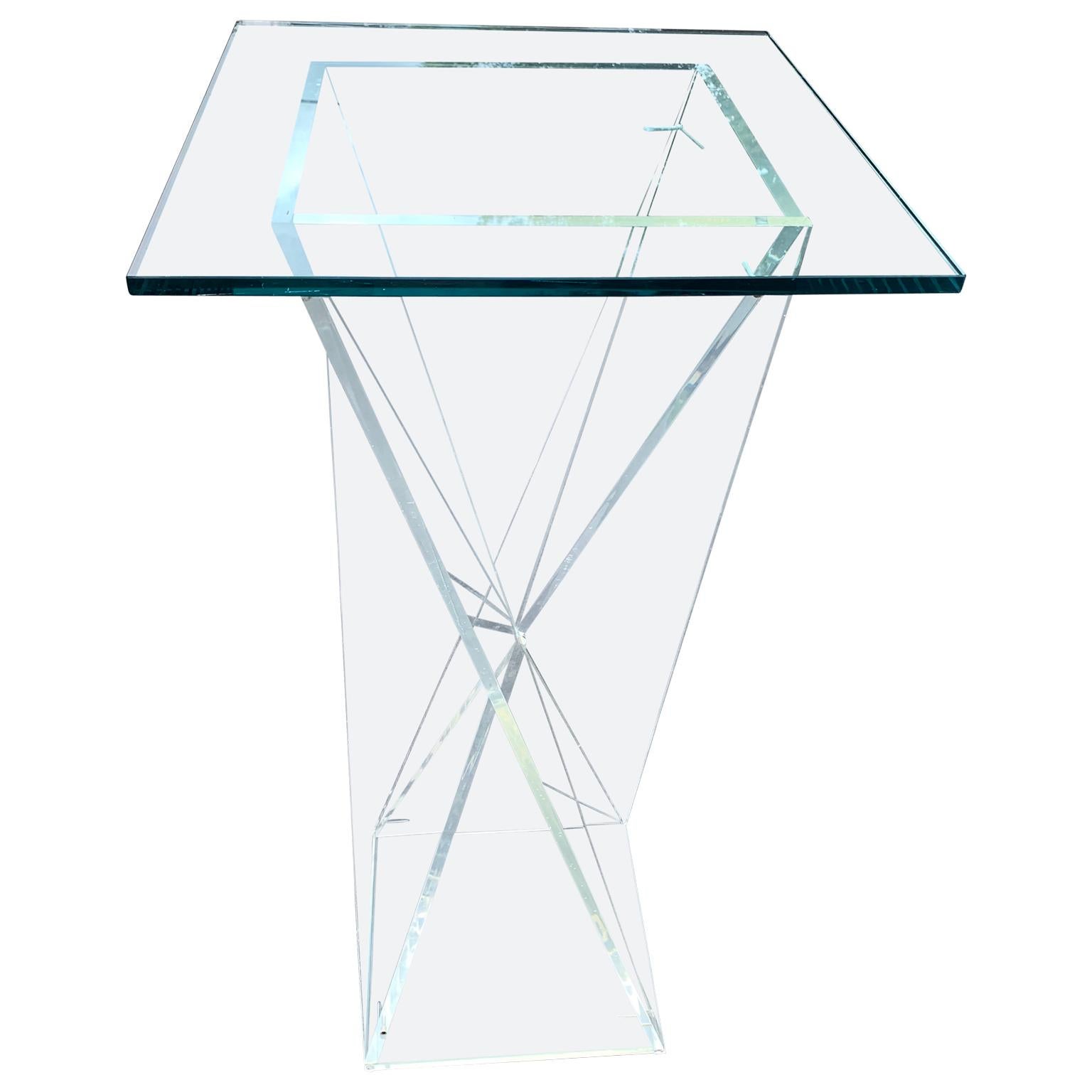 Square Mid-Century Modern Lucite Pedestal Table

Pedestal is sold without the glass top illustrated 

Pedestal is sold with a square glass top.