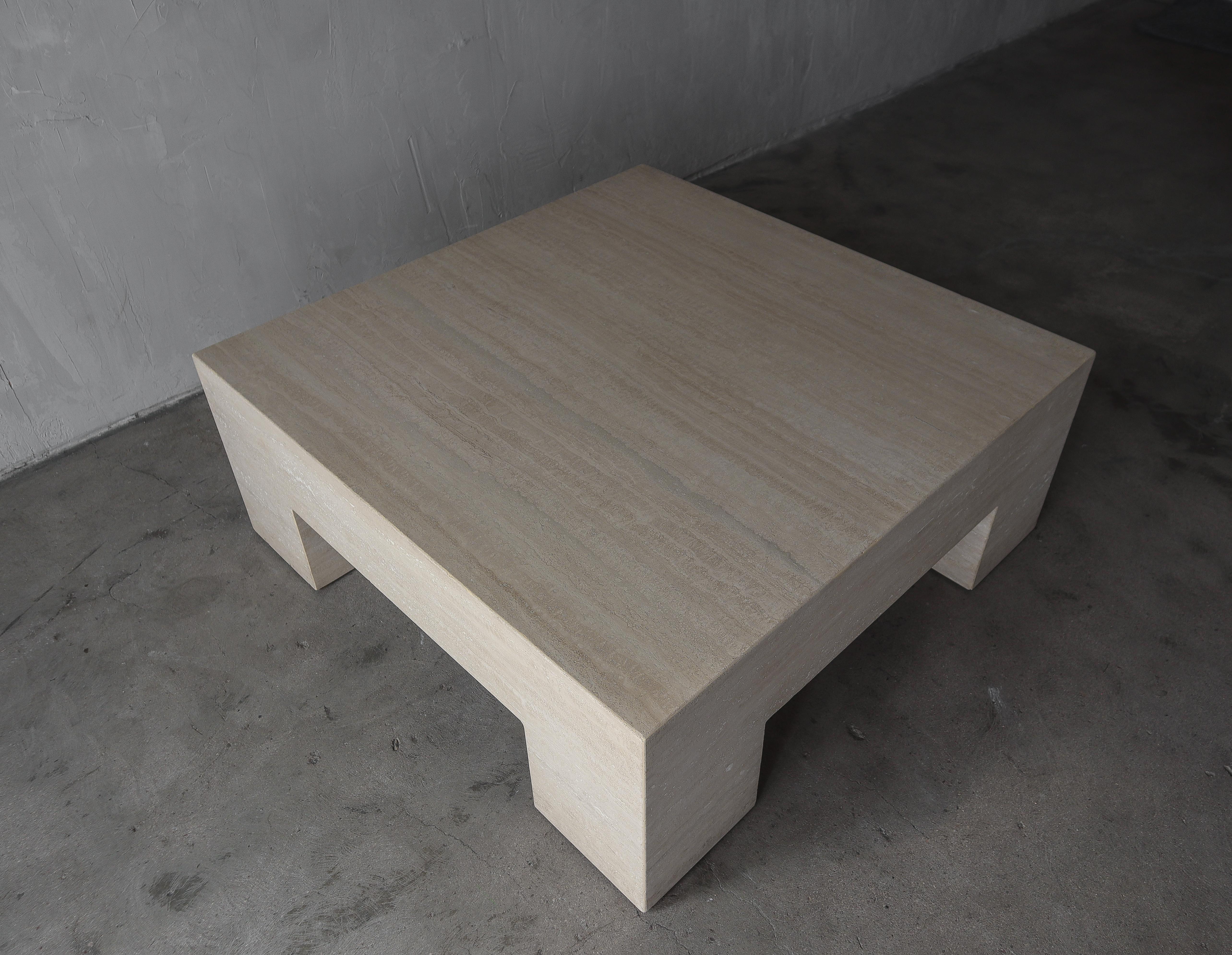 Make a huge statement with this monumental travertine coffee table. Table is very modern, with thick proportions. This table is the perfect piece if you need durability, size and style. 

Table is in excellent condition, it has natural inclusions