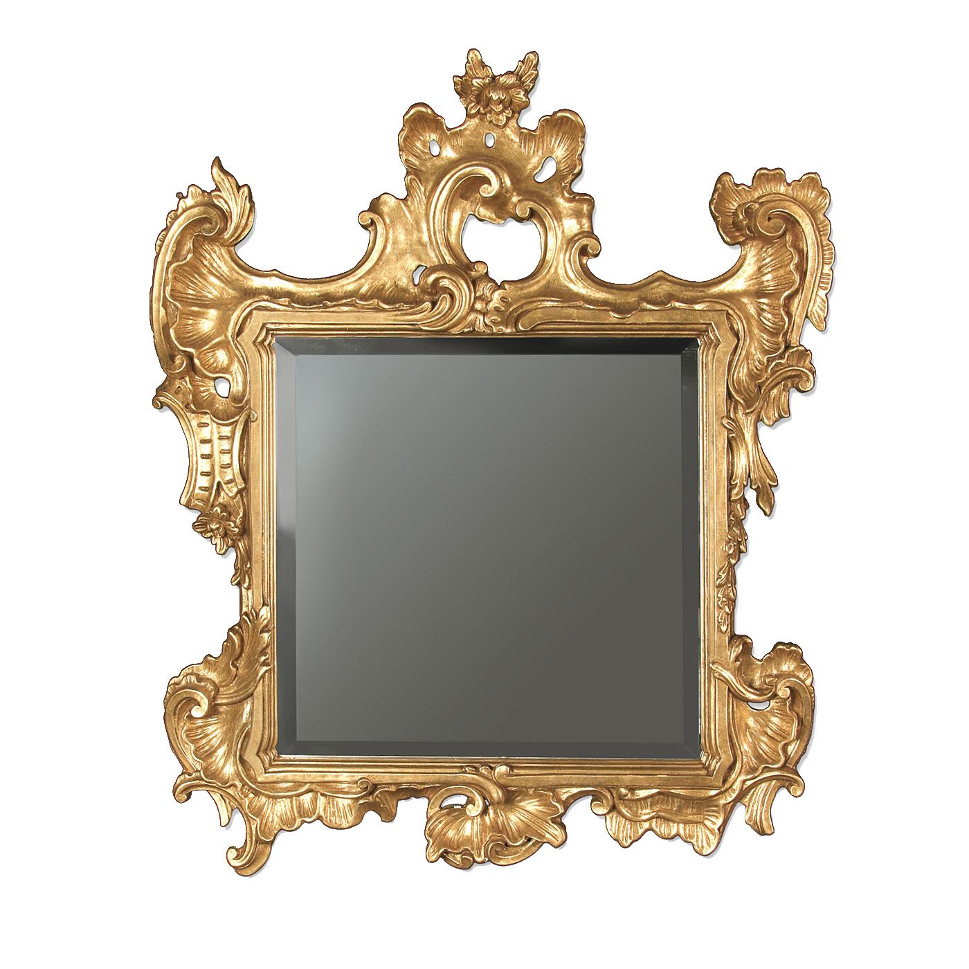 A magnificent example of the centuries-old tradition of Italian wood carving, the frame of this square mirror will adorn with effortless sophistication a classic home. The complex coils of this piece were carved by hand in wood and finished with a