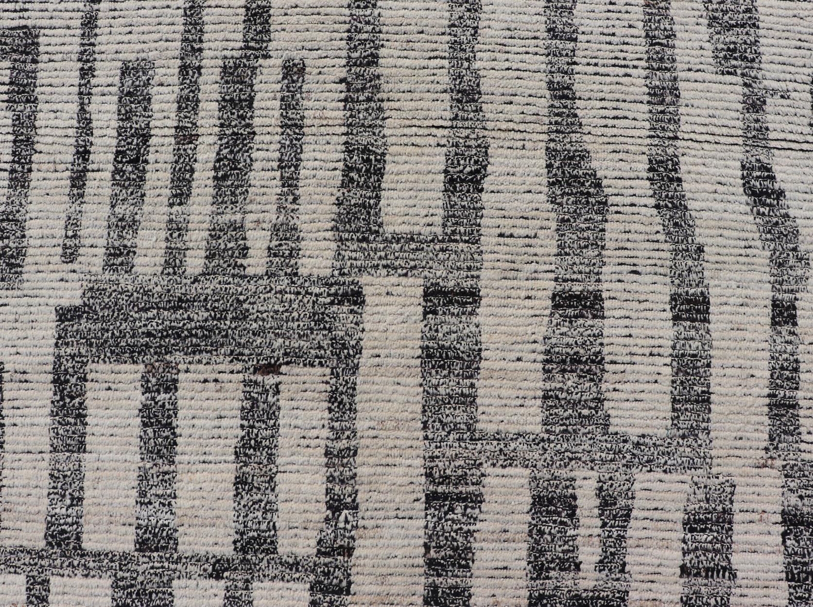 Measures: 13'4 x 14'4 
The Striking Modern Moroccan Style Tribal Rug captures the essence of contemporary design while paying homage to traditional Moroccan artistry. Featuring bold geometric patterns in a classic black and white color scheme, this