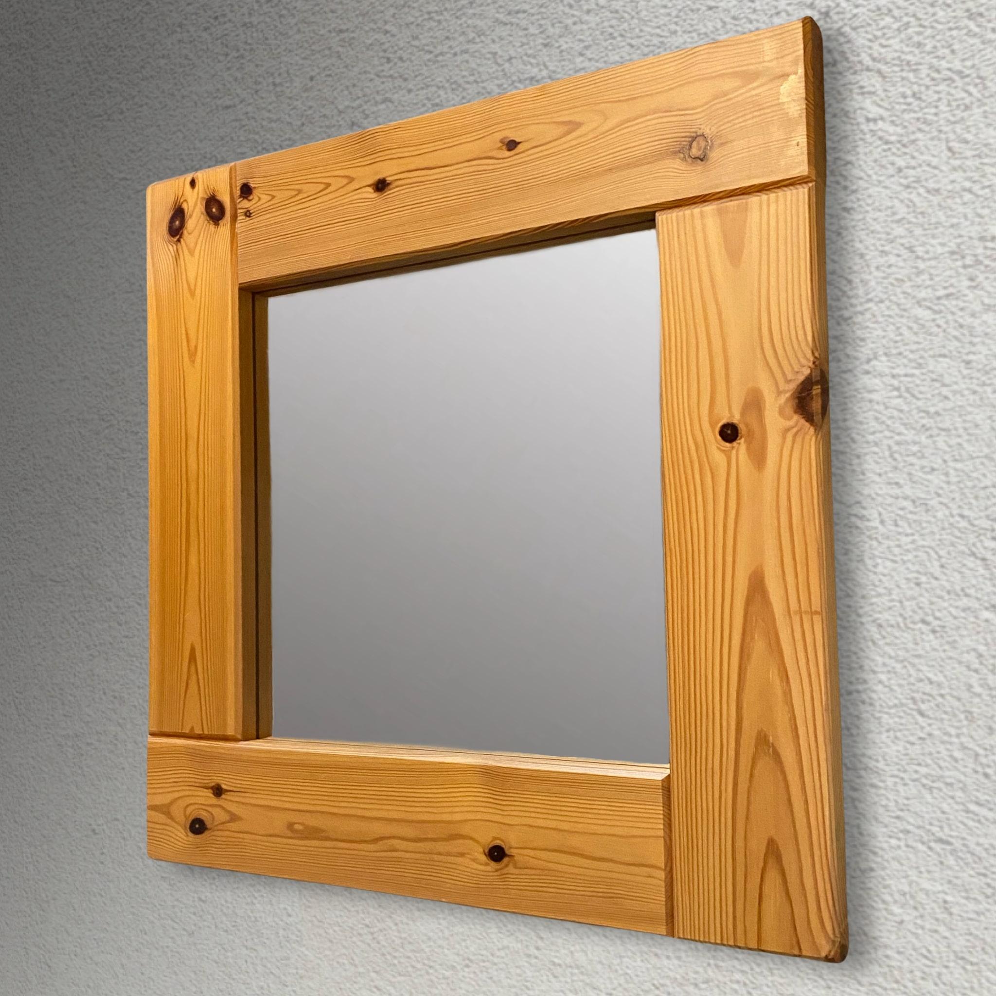 Swedish 1970s mirror made from solid pinewood. Square model with a rustic aesthetic typical of the period. Two plastic fittings on the backside for easy wall mounting.

Pine is a common tree in forests all over Sweden, and it has traditionally been