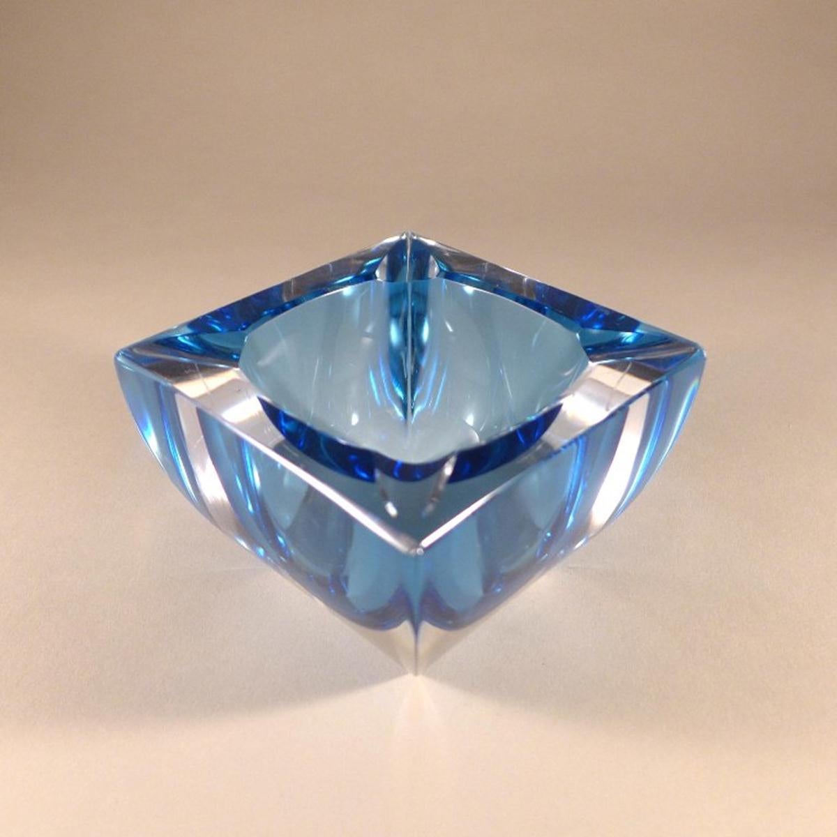 Curved square Murano Sommerso glass ashtray with a blue centre cased in clear glass, 1960s.
 