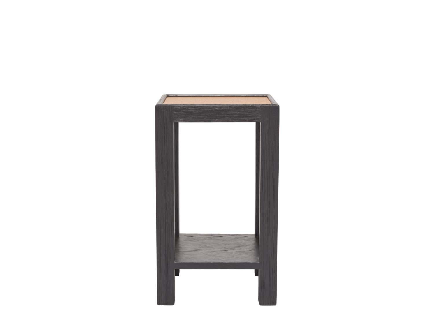 The narrow side table is made of solid American walnut or white oak and features a lower shelf and your choice of a cork or bronze mirror top. 

The Lawson-Fenning Collection is designed and handmade in Los Angeles, California. Reach out to