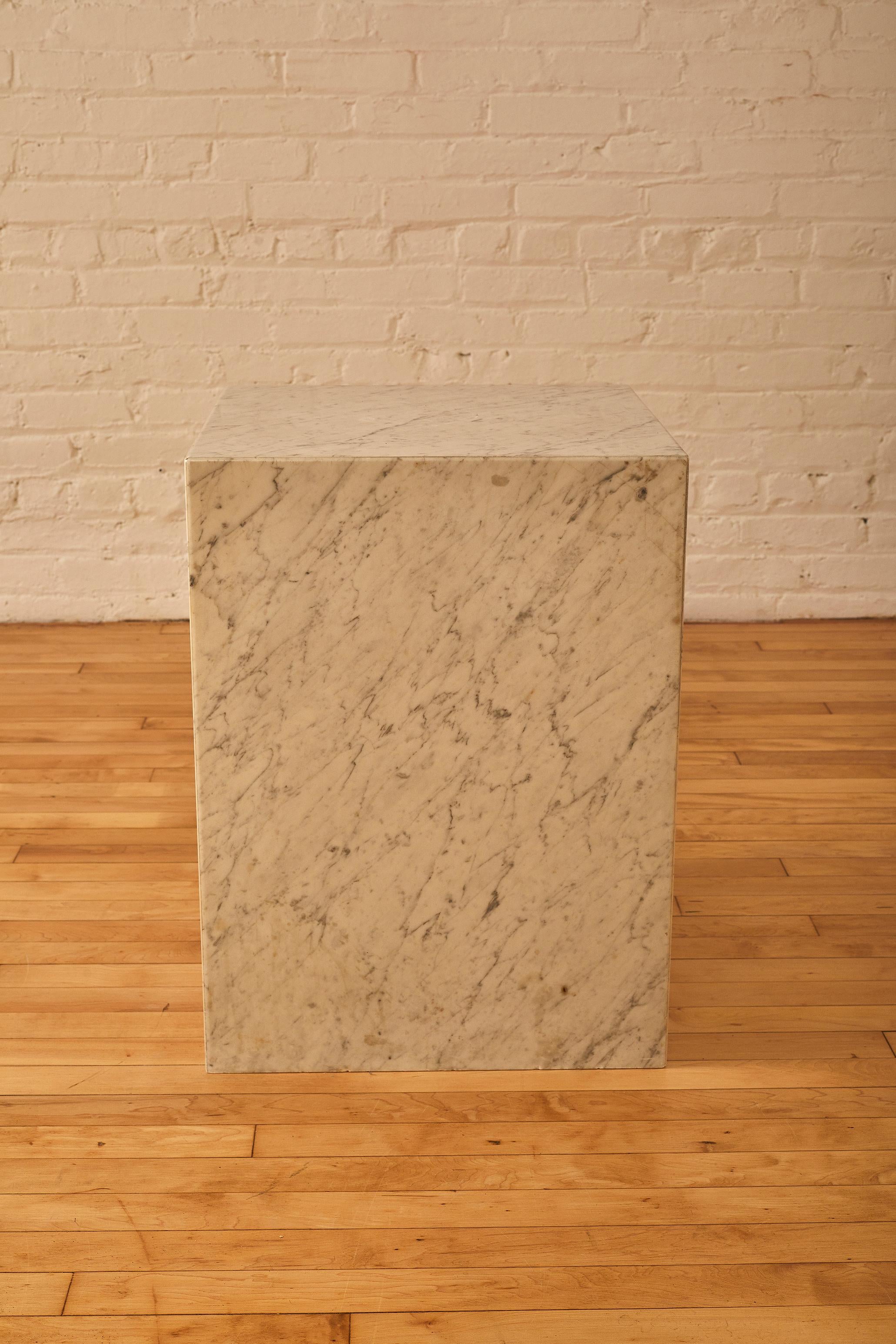 Square Pedestal/side table in Carrara marble. Carrara Marble comes from, Carrara, city, Tuscany, north-central Italy. The city is famous for some of the world’s finest marble, called Carrara, used by sculptors from Michelangelo to Henry Moore.

