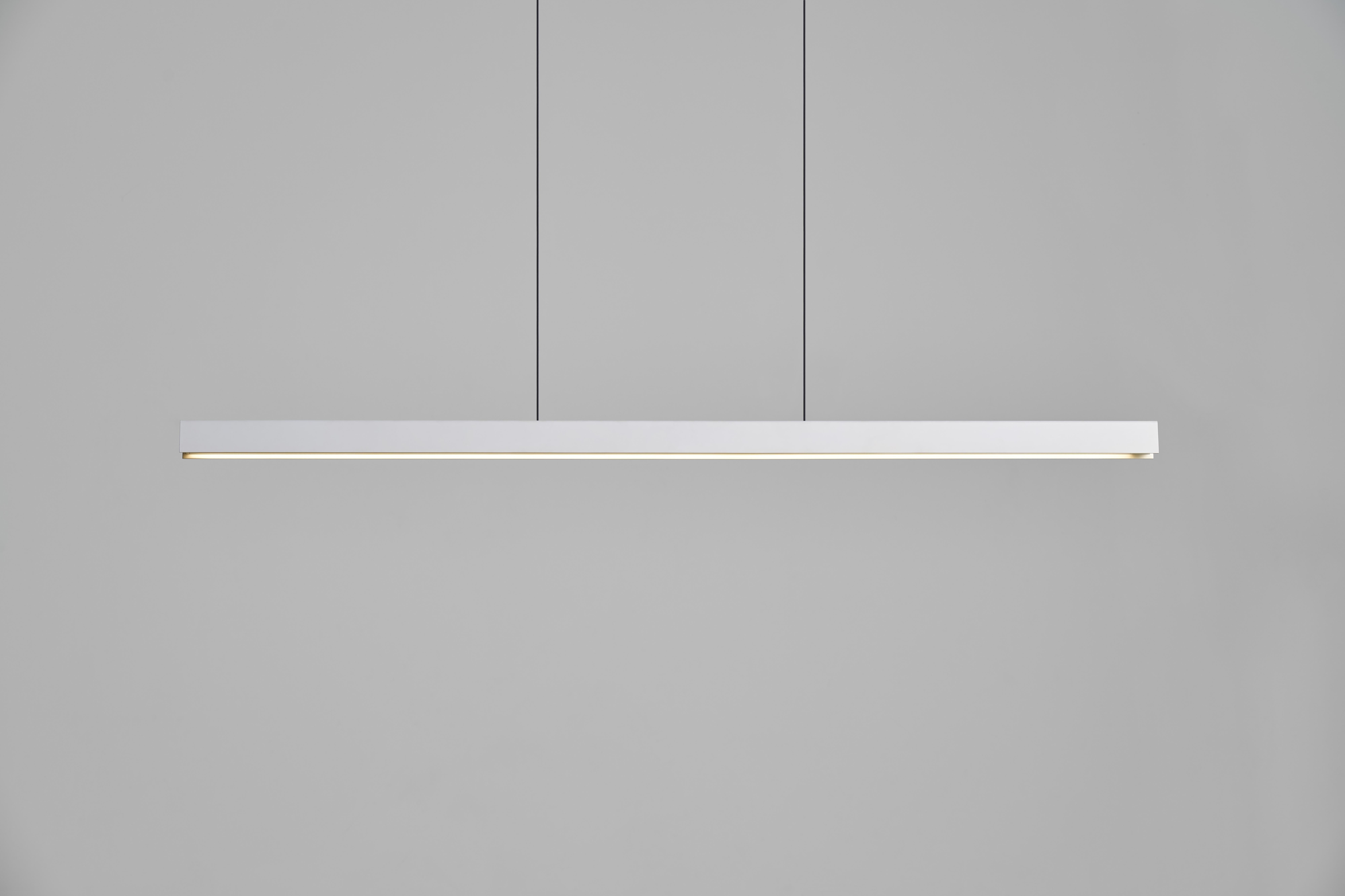 The Square pendant is simplistic yet sophisticated in both function and design. The exterior is available in Black or White, while the inner surface is finely coated in Brushed Gold. The lamp is can be controlled by touchless sensors located on one