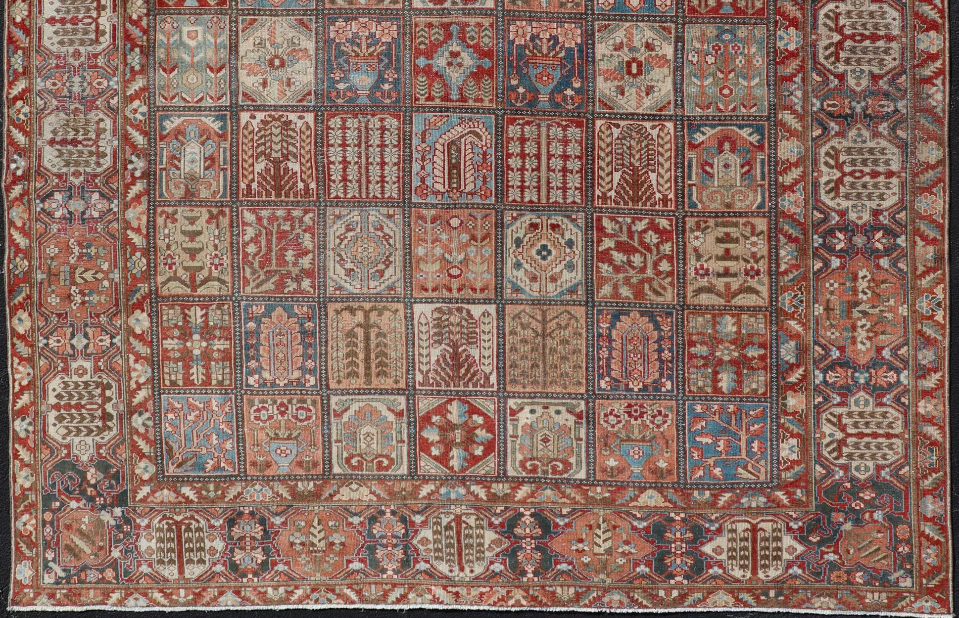 Large hand knotted Persian Bakhtiari rug with all-over garden design. Keivan Woven Arts / rug EMB-9704-P13455, country of origin / type: Iran / Bakhtiari, circa 1930
Measures: 10'9 x 11'10.
This antique Bakhtiari features a decorated all-over motifs