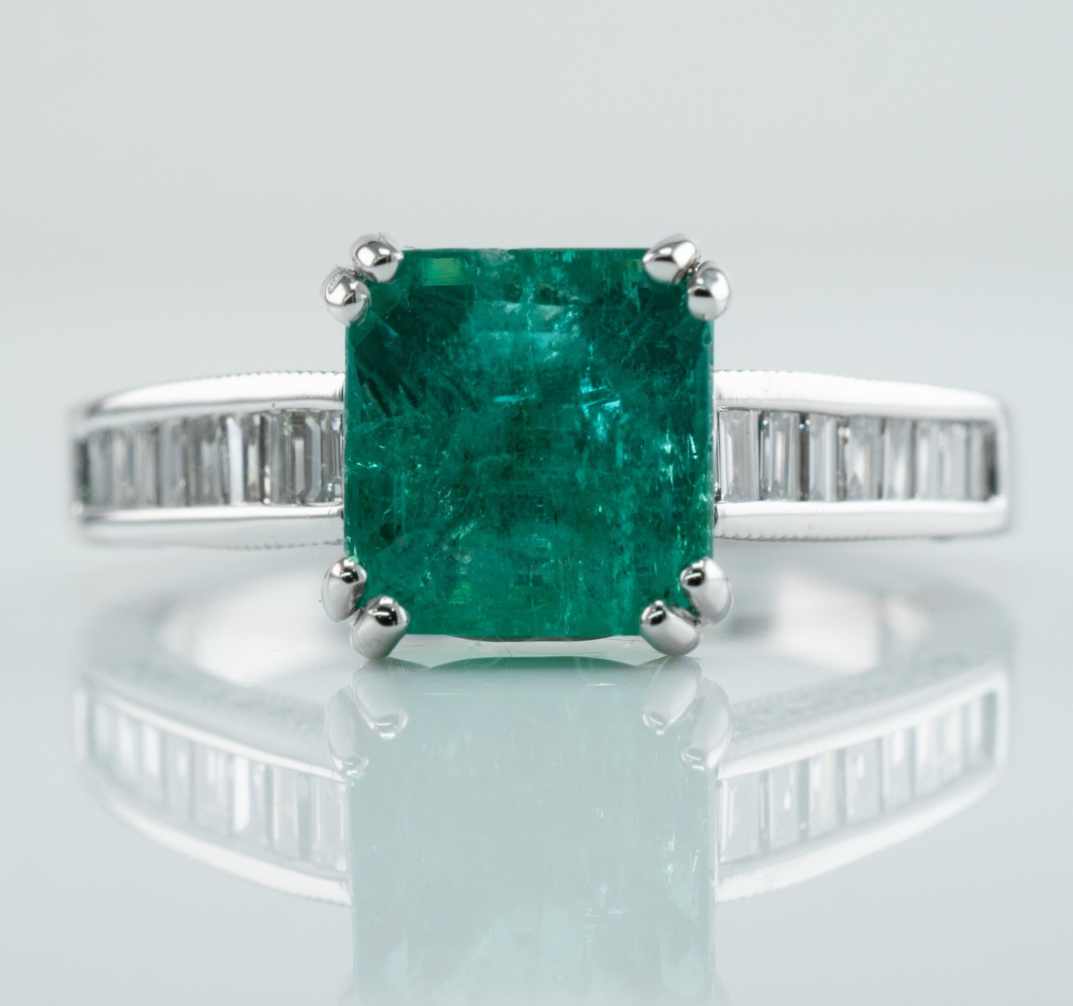 This estate ring is crafted in solid 14K White Gold and set with genuine Earth mined Emerald and Diamonds.
The center square cut Colombian Emerald measures 7mm x 7mm (about 1.70 carat).
This is a good quality gem with natural inclusions.
It has some