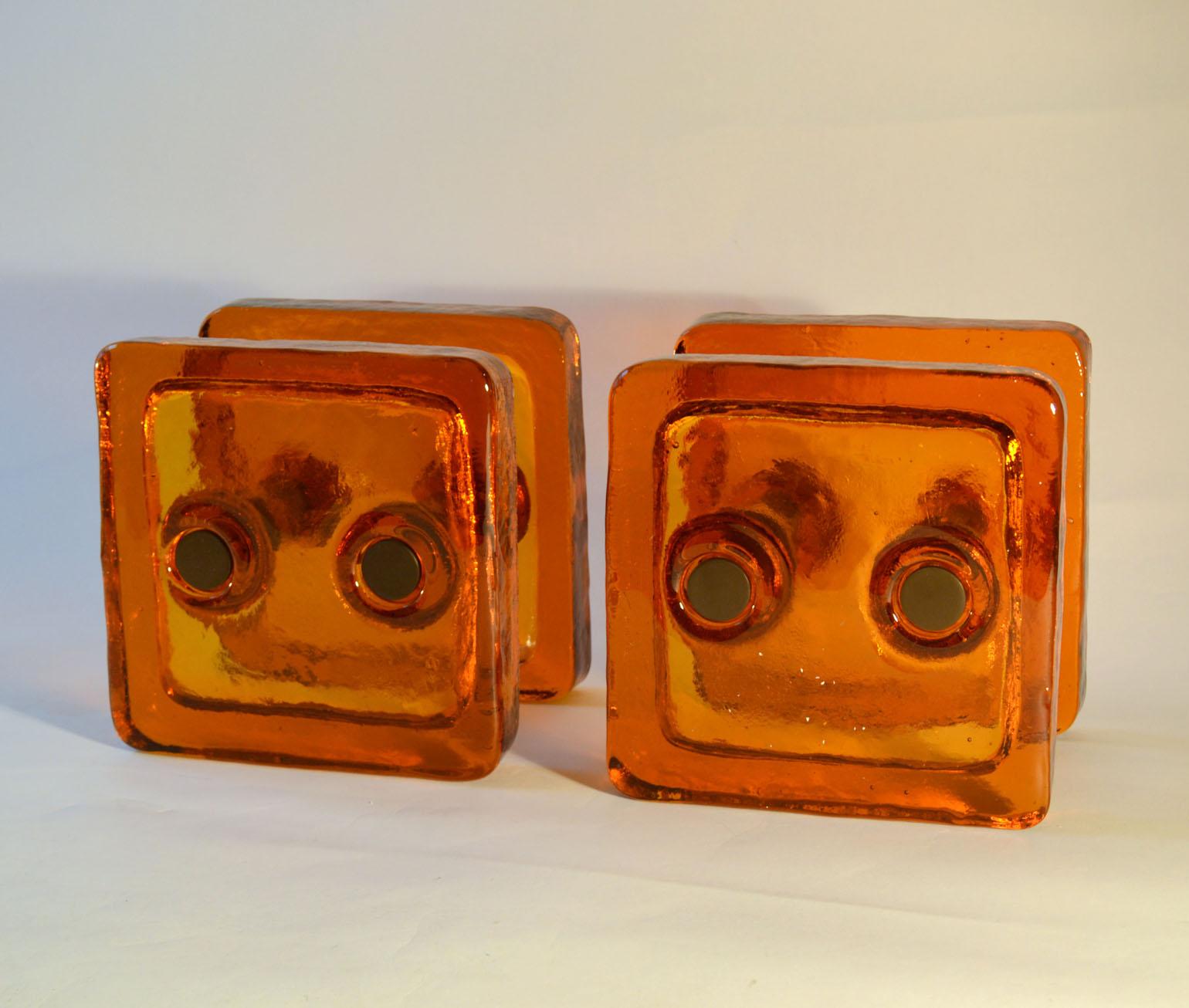 Pair of orange glass cast square glass push and pull door handles with bronze color fittings designed for a glass door, French, 1960's.
The fixings can be adjusted for wooden doors.
Each glass piece;
Measures: 21 x 21 x 3 cm
Distance between the