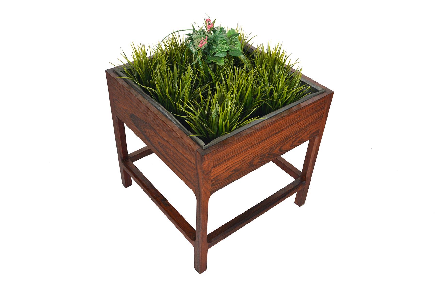 This gorgeous Danish modern planter box by Aksel Kjersgaard features a rosewood construction and beautifully designed geometric frame. Includes the original galvanized liner. In excellent original condition.

  