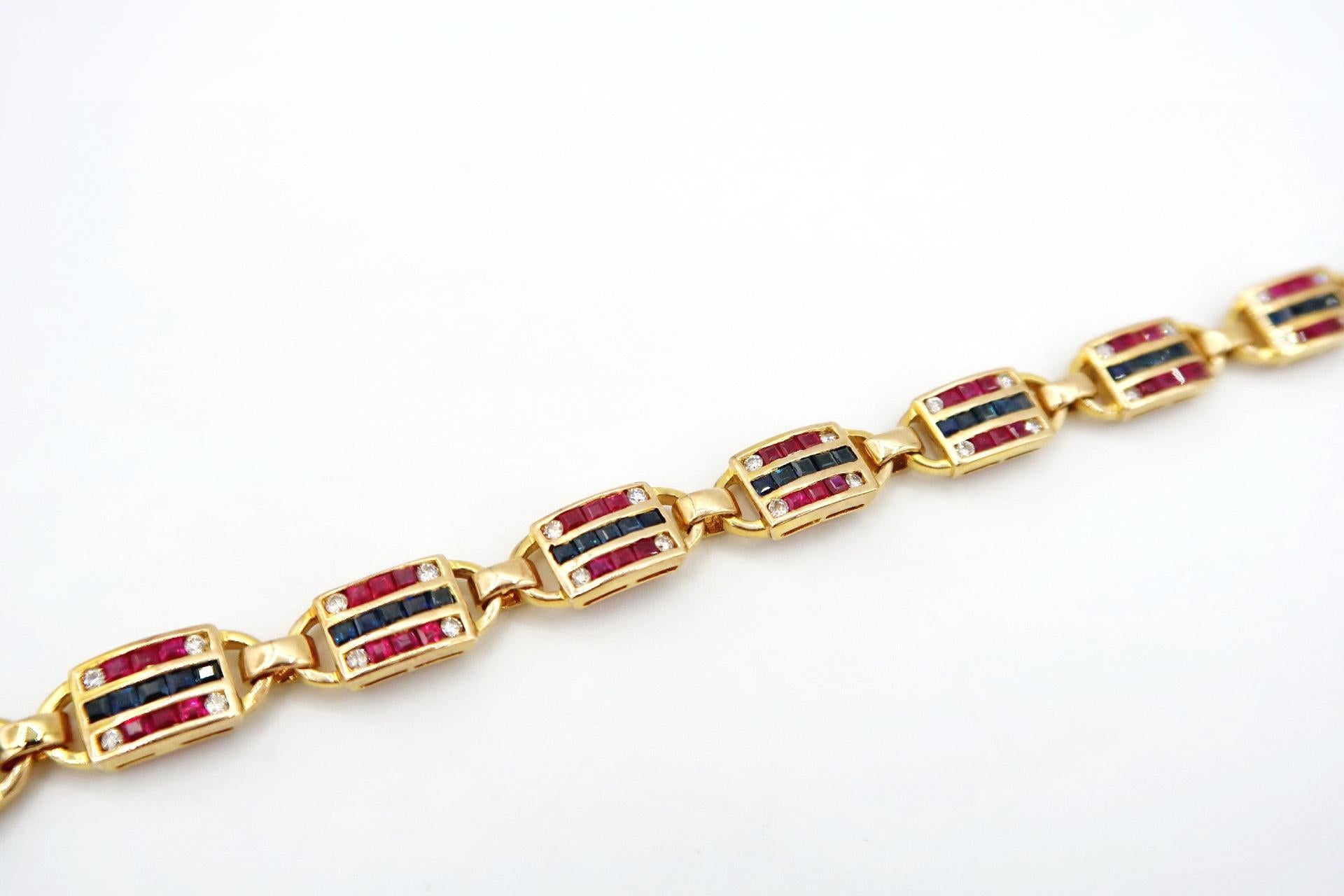 Vibrant Square Ruby Blue Sapphire Diamond Striped Banner Link Bracelet in 18K Yellow Gold

Gold: 18K Yellow Gold, 18.65 g
Ruby: Square, 3.13 ct
Sapphire: Square, 2.42 ct
Diamond: Round, 0.60 ct

Length: 7 inches