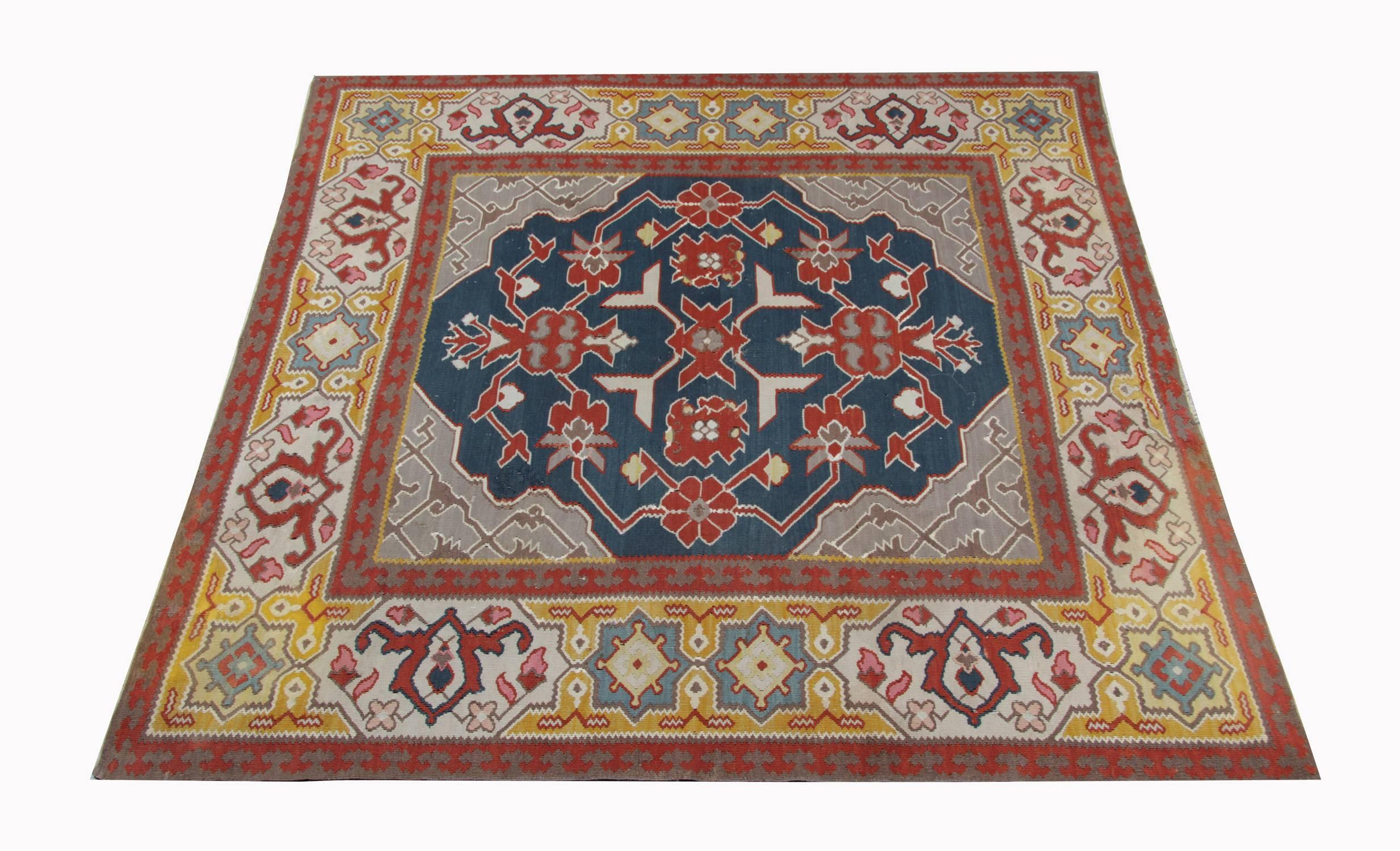 An unusual rugs example of Balkan Pirot Kilim rugs in excellent condition. These kinds of traditional rugs are flat-weave rugs named Kilim that most of the time have a geometric design with a brilliant colour combination such as red, dark green,
