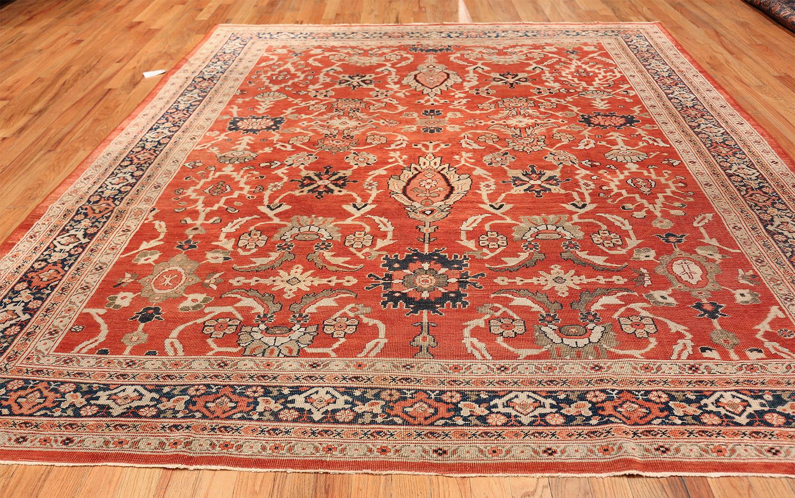 Magnificent And Luminous Rusty Red Background Square Antique Persian Sultanabad Rug, Country of Origin / Rug Type: Persian Rug, Circa Date: 1900 – A luminous rusty red background creates a spectacular background that displays the floral and