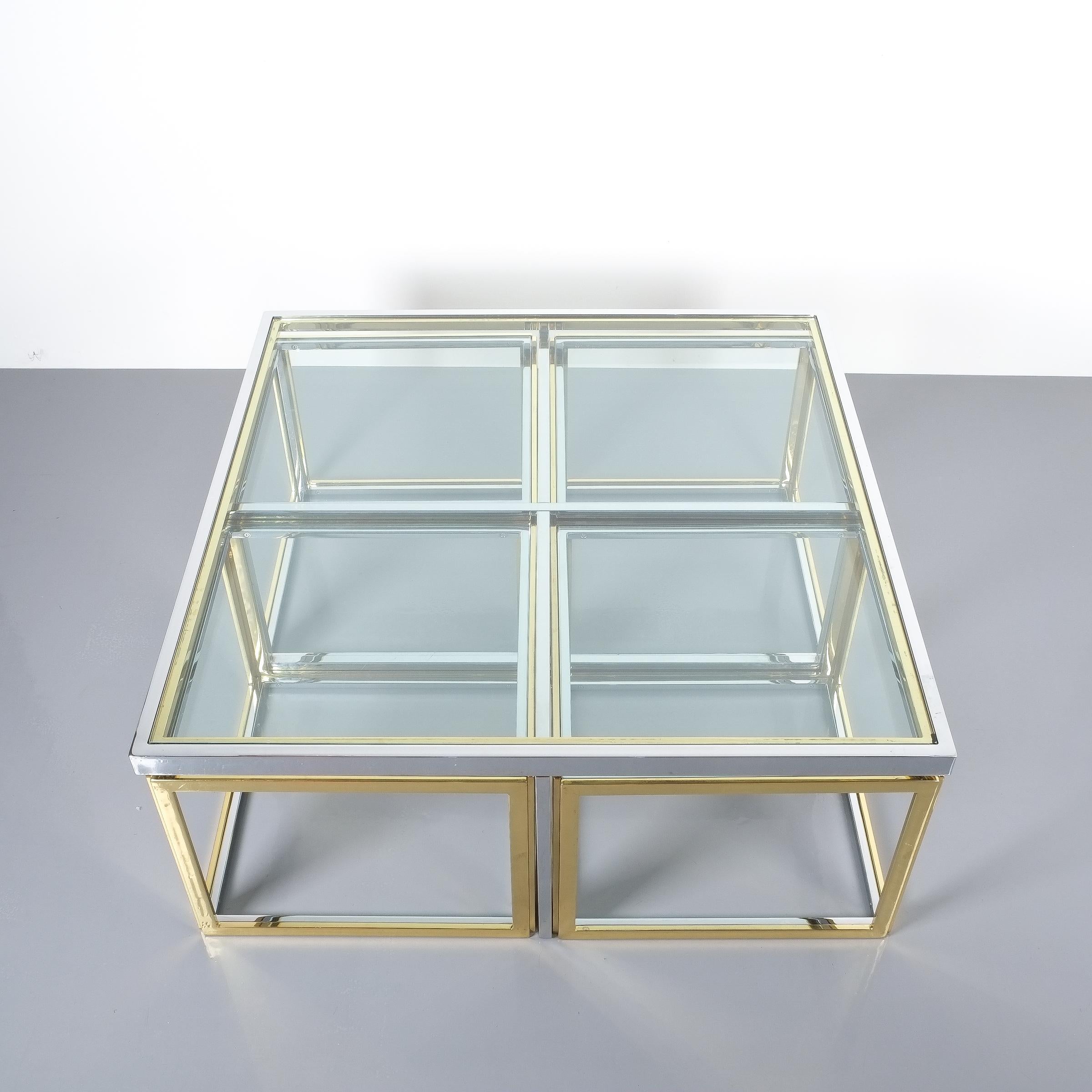 Square segment bicolor brass glass coffee table by Maison Charles, France, 1975. Vintage square brass coffee table with four removable segments featuring customized clear glass table tops and brass and chrome hardware/bases. The condition is very