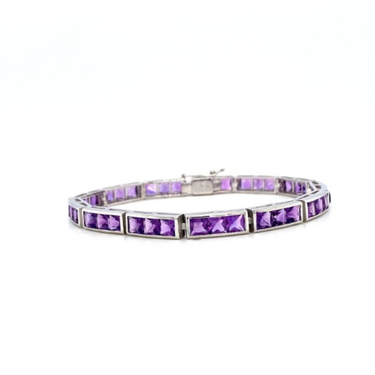 Square Shape Amethyst Tennis Bracelet in sterling silver showcases endlessly sparkling natural amethyst, weighing 15.60 carat. It measures 7 inches long in length. 
Amethyst stimulate concentration and reduces stress. 
Designed with perfect square