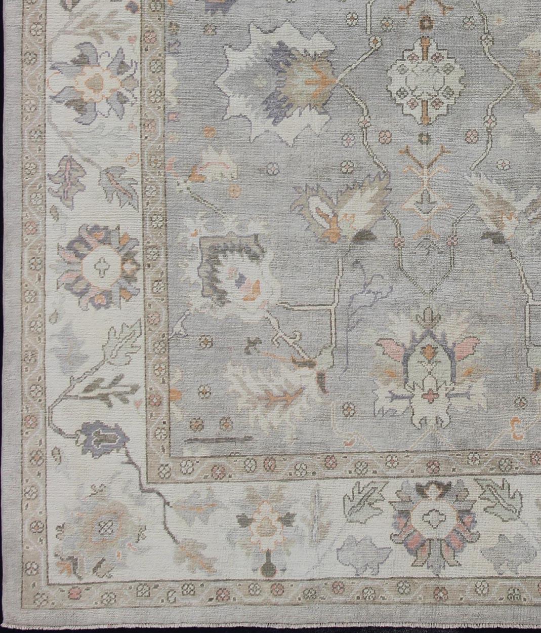 Turkish Oushak rug with neutral color palette and all-over flower design, rug en-176558, country of origin / type: Turkey / Oushak

This traditional Oushak rug from Turkey features a subdued, neutral color palette and an all-over design of floral