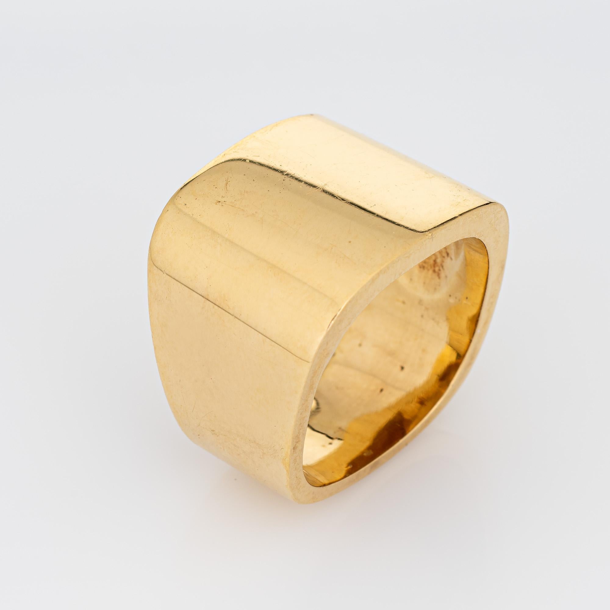 Stylish vintage 18k gold square signet cuff ring (circa 1980s).

The beautifully crafted ring highlights a distinct square design. The ring has a weighty feel (19.5 grams) and makes a great statement on the hand. The wide band (17mm - 0.66 inches)