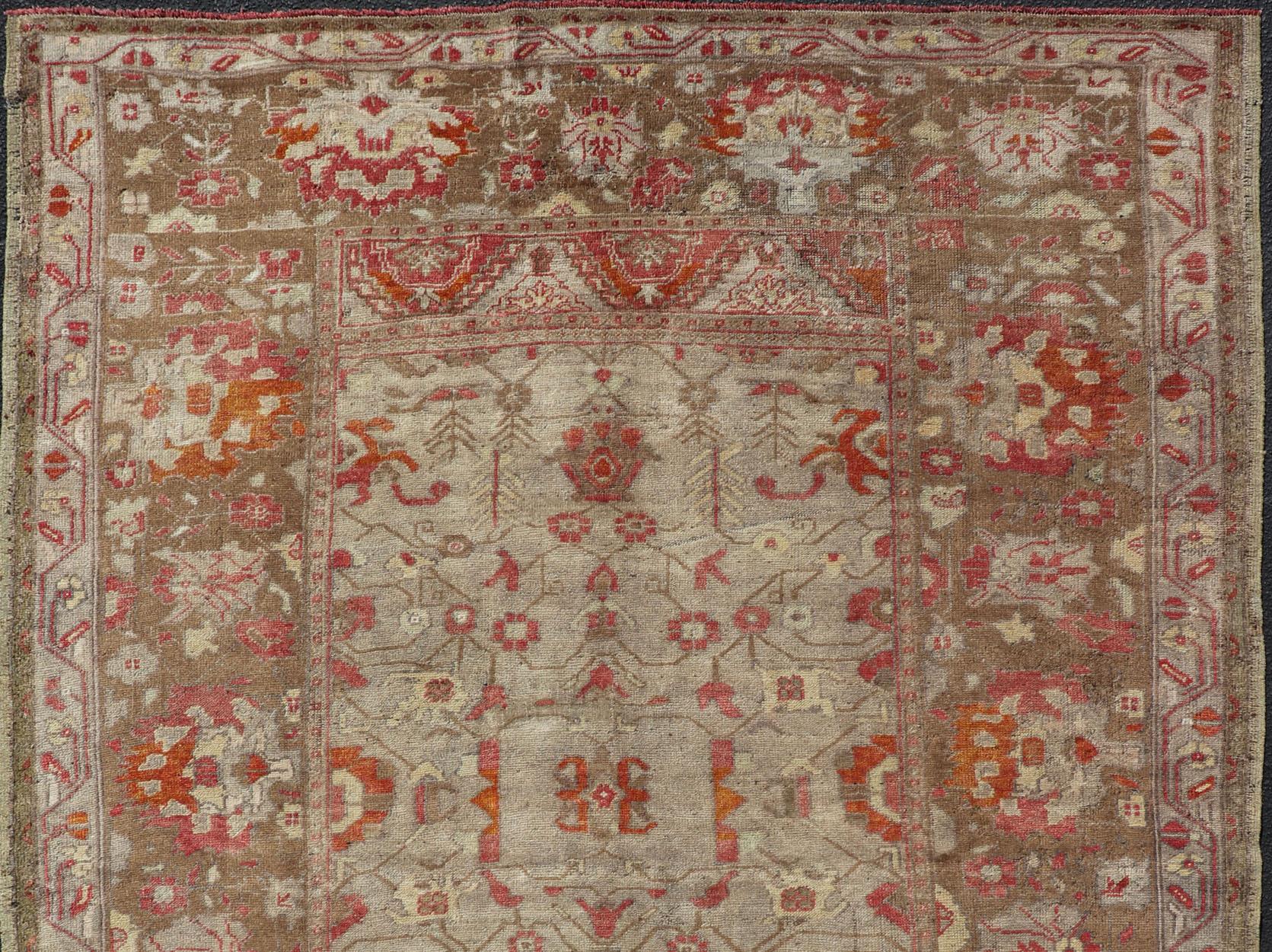 Square size Antique Turkish floral Oushak rug in green, red & tan.

Vintage Turkish Oushak Floral Medallion Design in Camel, brown, and red. Keivan Woven Arts / rug EN-180000, country of origin / type: Turkey / Oushak, circa 1930.

Measures: