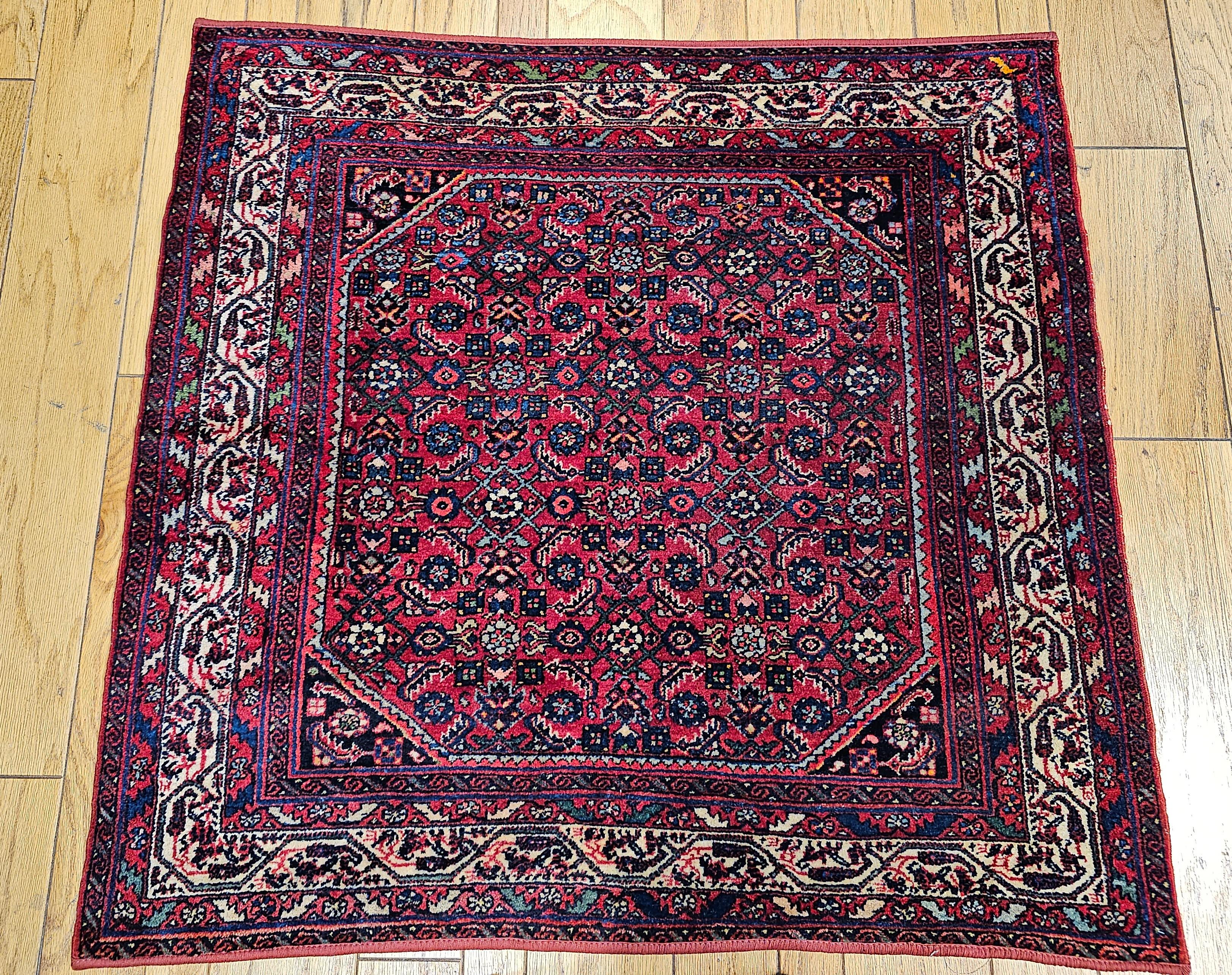 Square size vintage Persian Malayer rug is in an all-over Herati pattern.  The rug has a red background and an ivory color border with small corner spandrels in navy blue. The rare square size makes the rug very desirable.
Dimensions:  4’ 2” x 4’