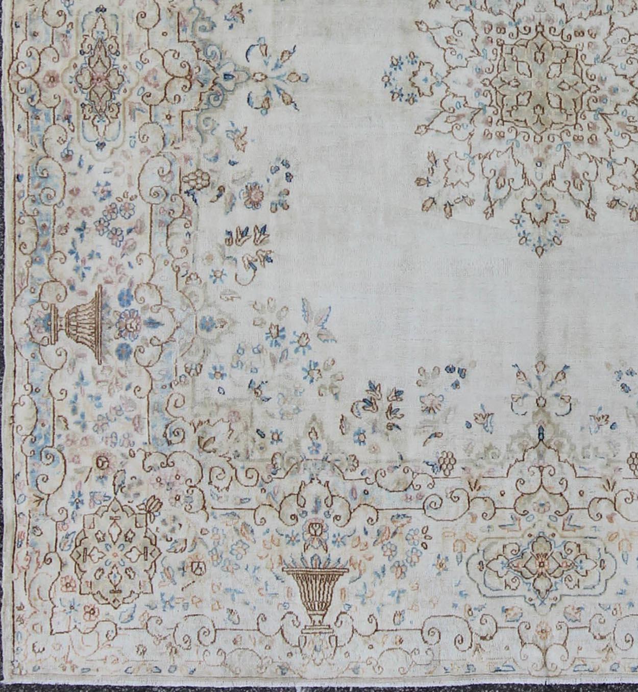 Antique Kerman carpet with floral design, rug F-1002, country of origin / type: Iran / Kerman, circa 1920

This Kerman carpet from early 20th century Persia features a floral design set atop a light background.
Measures: 6'10 x 7'1.
 