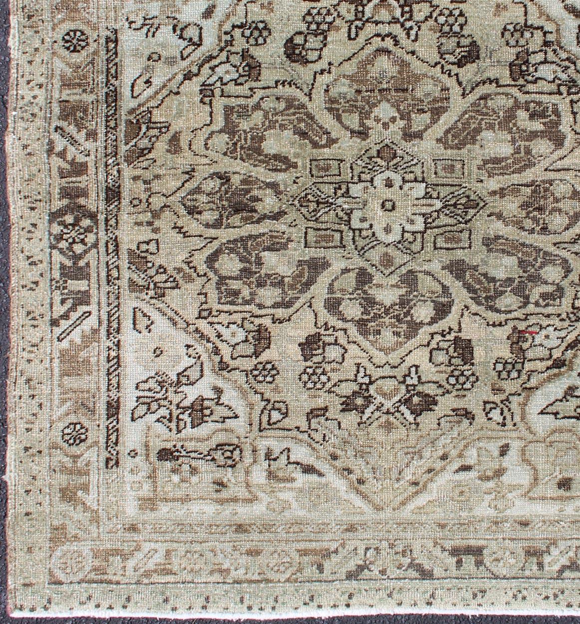 Vintage Persian carpet with Taupe, brown, ivory Medallion design, ca-13541, country of origin / type: Iran / Heriz, circa 1950

This nearly square-shaped Heriz carpet from midcentury Persia features an expansive layered medallion design in its
