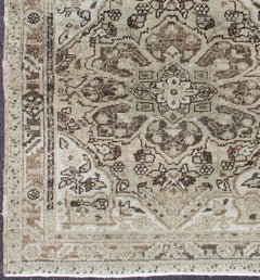 Persian Heriz Rug with Large Central Medallion and Faded Earth-Tone Palette