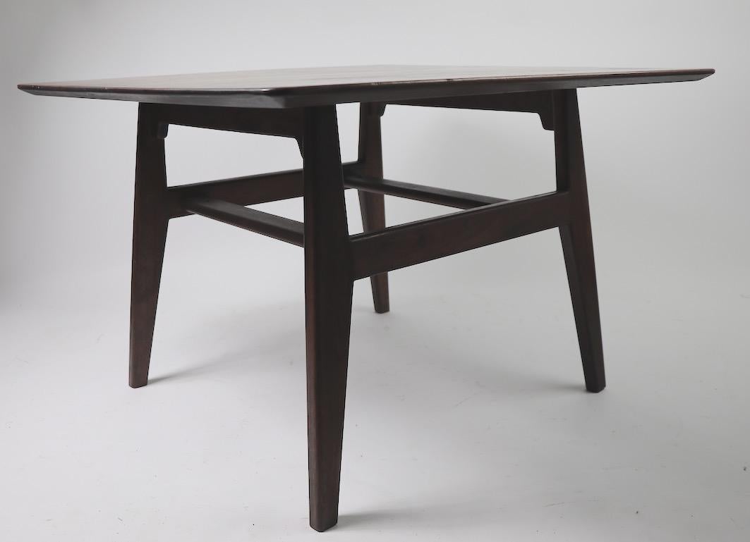 Square table designed by Jens Risom for Jens Risom Design Inc. This example shows cosmetic wear to the finish, as shown. No structural damage, chips, cracks etc.