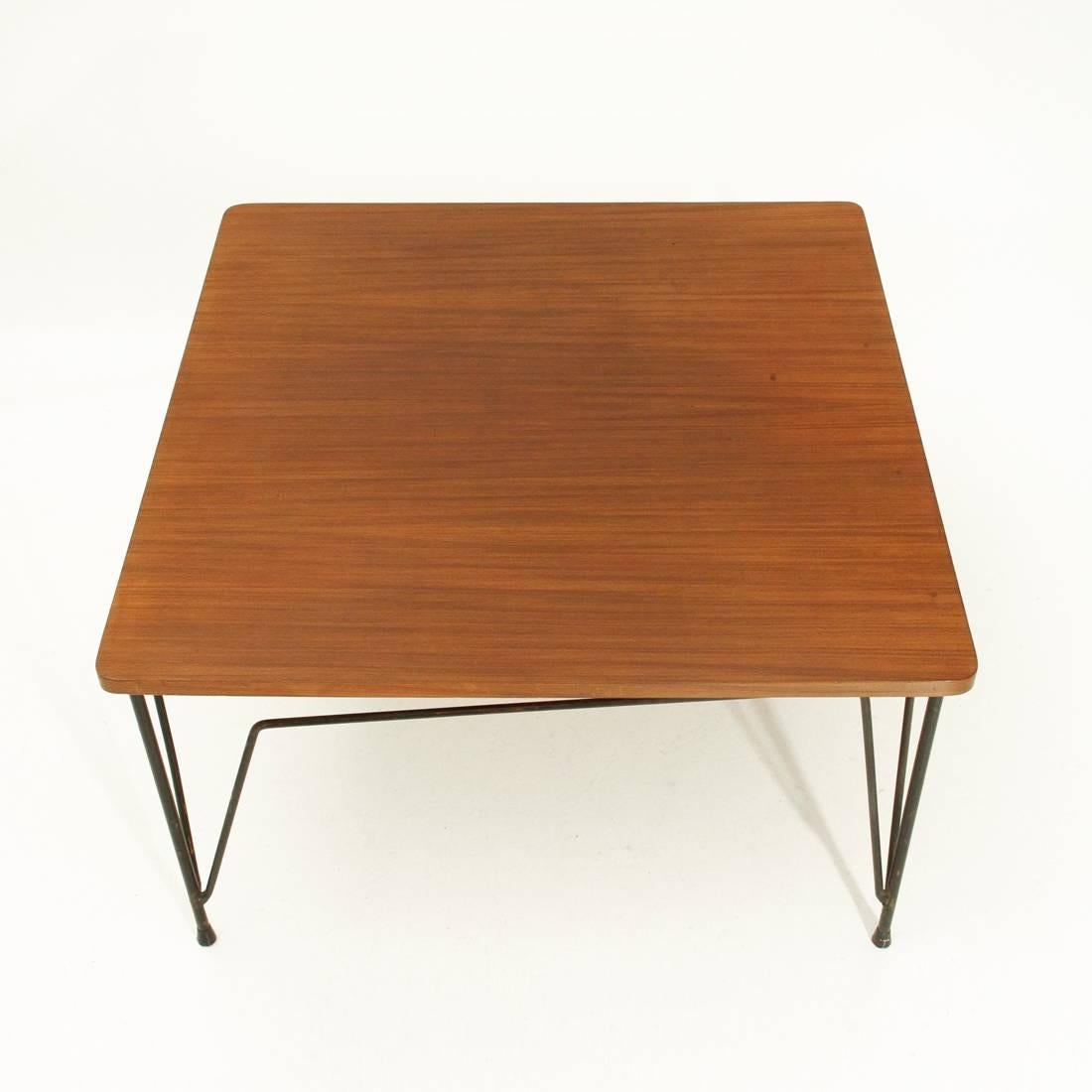 Coffee table produced in the 1950s by Cerutti.
Square top in teak veneered wood.
Legs in black painted metal rod.
Good general conditions.

Dimensions: Width 71 cm, depth 71 cm, height 41.5 cm.
 